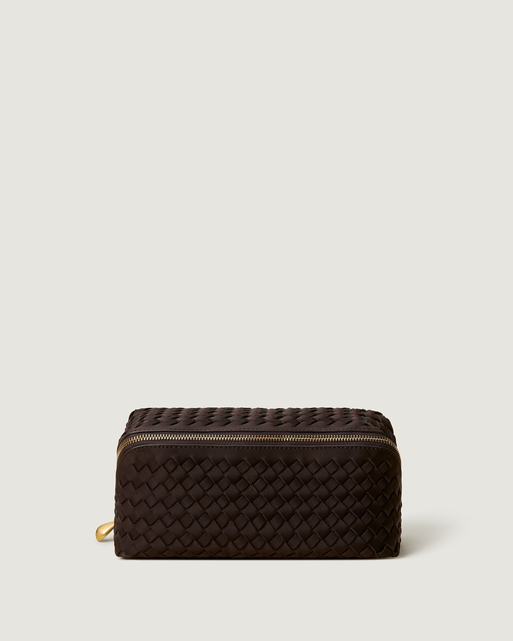 Caravan Cosmetic Case in Chocolate, a dark chocolate brown tone, in handwoven neoprene, featuring a wrap-around zip closure.