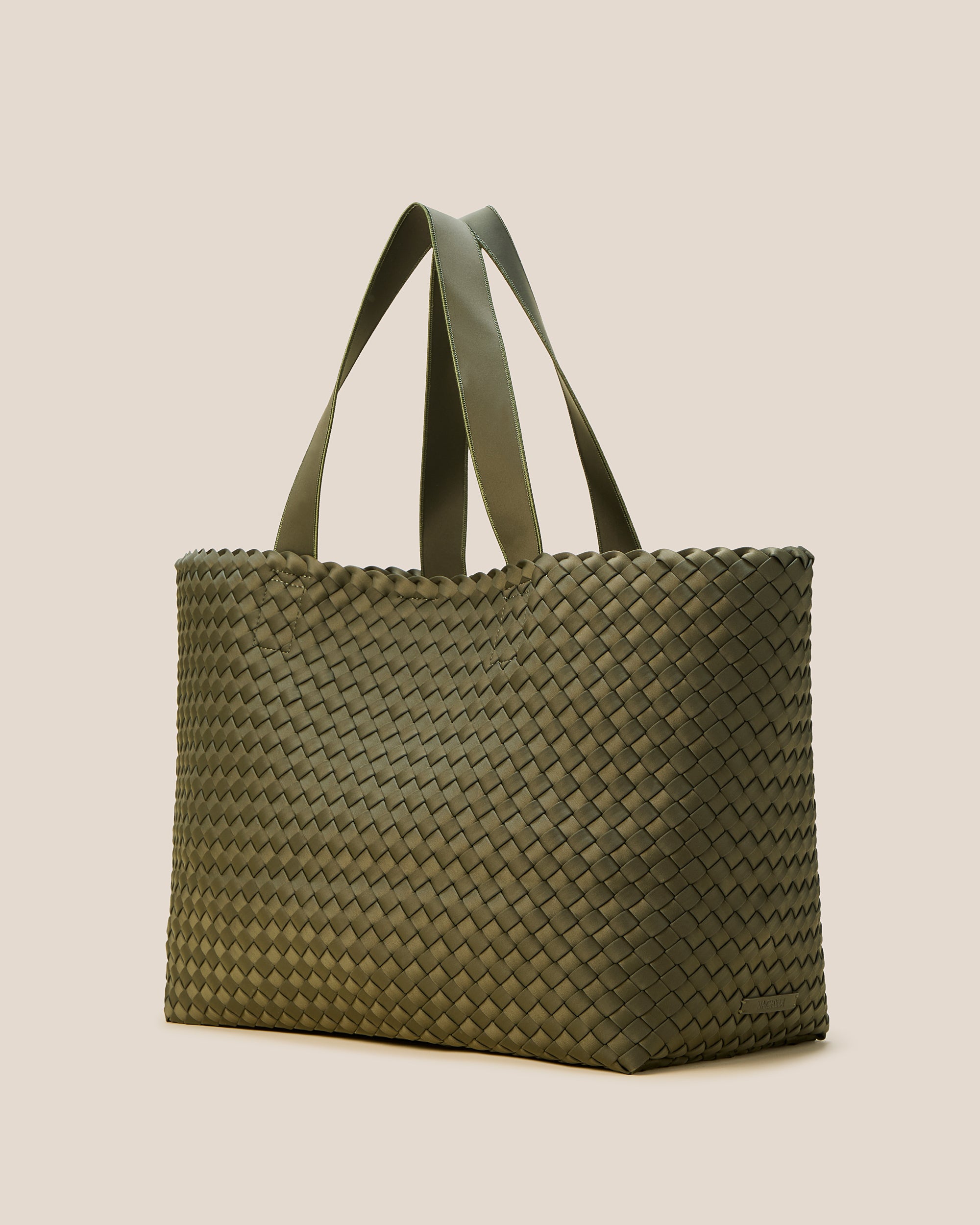 Como Tote in Olive shown from a side angle, highlighting its handwoven neoprene construction and open top with magnetic snap closure.