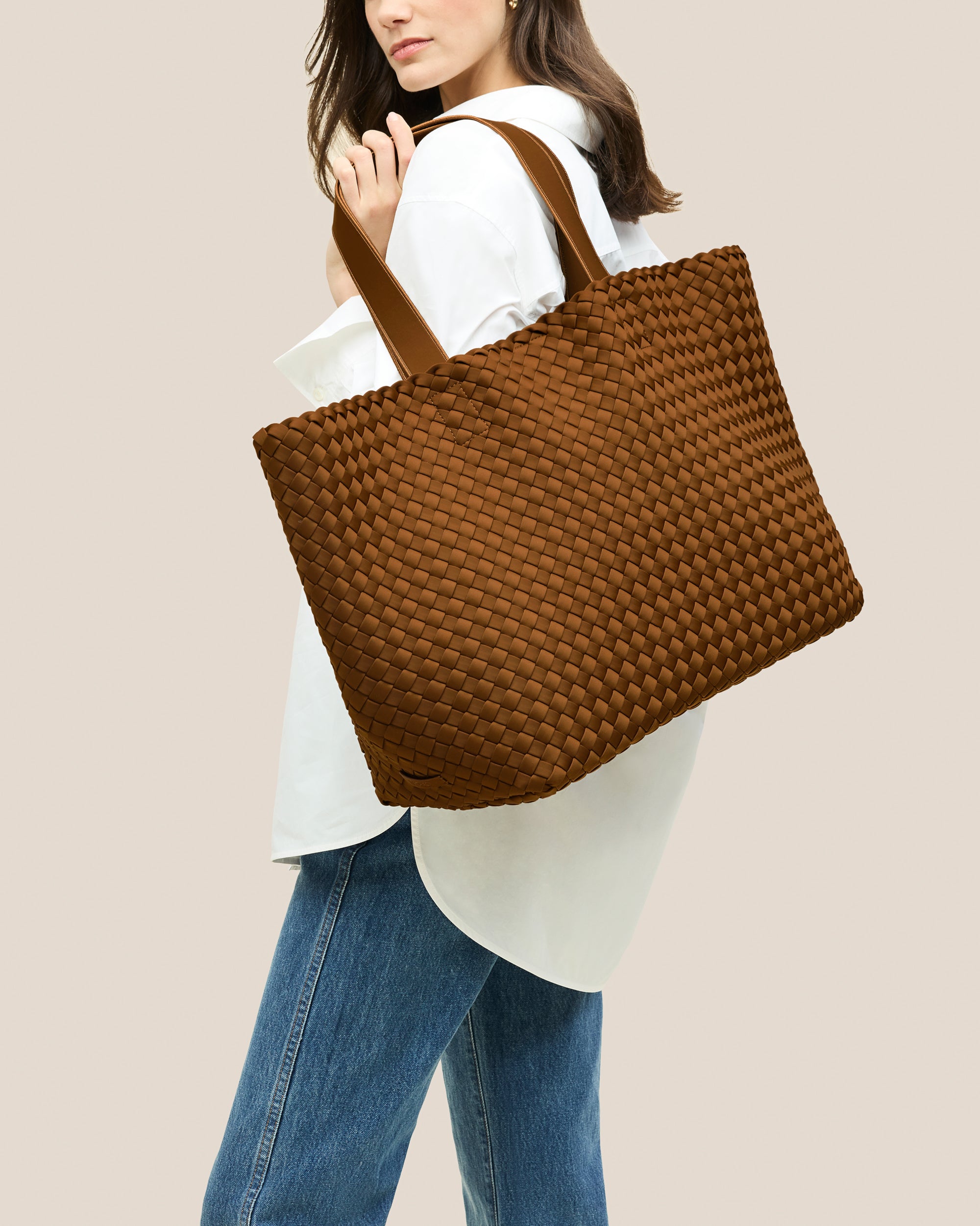 Como Tote in Teak shown on model to illustrate scale and soft silhouette.