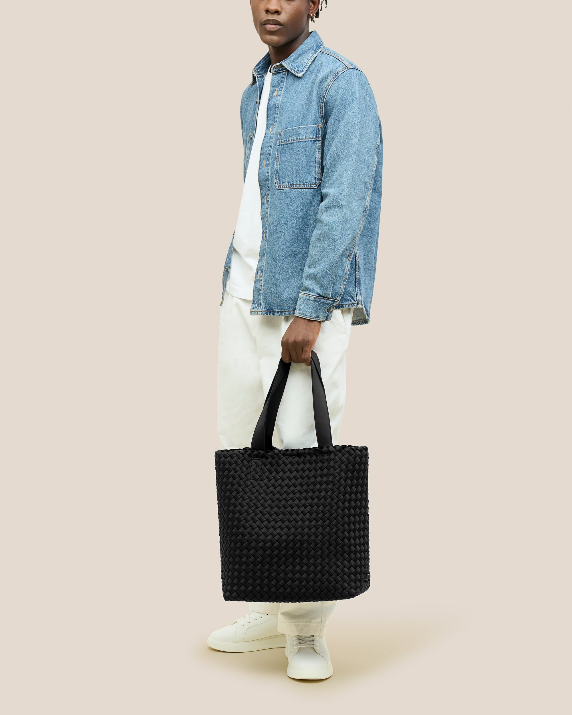 Como Tote in Onyx shown on model to illustrate scale and soft silhouette.