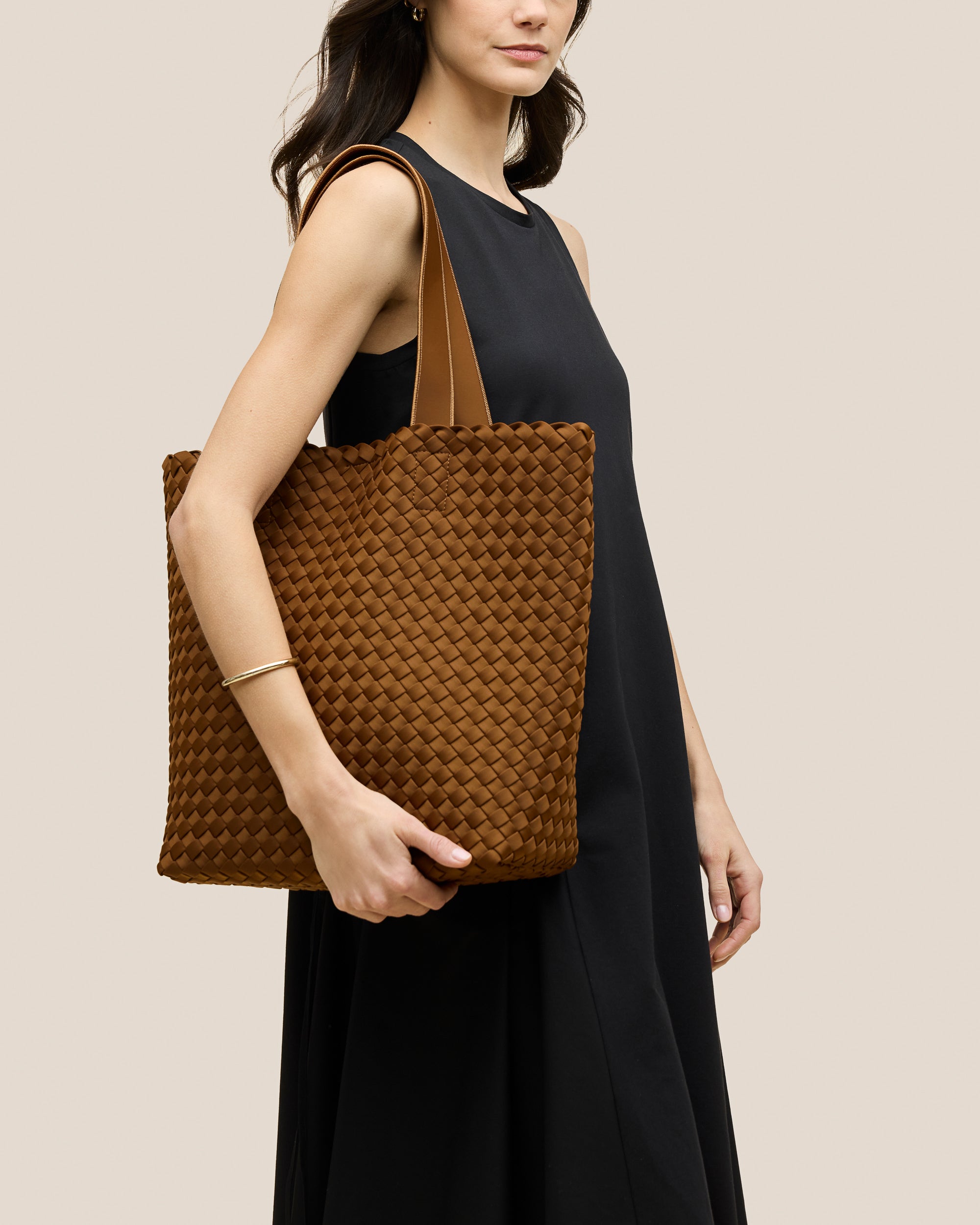 Como Tote in Teak shown on model to illustrate scale and soft silhouette.