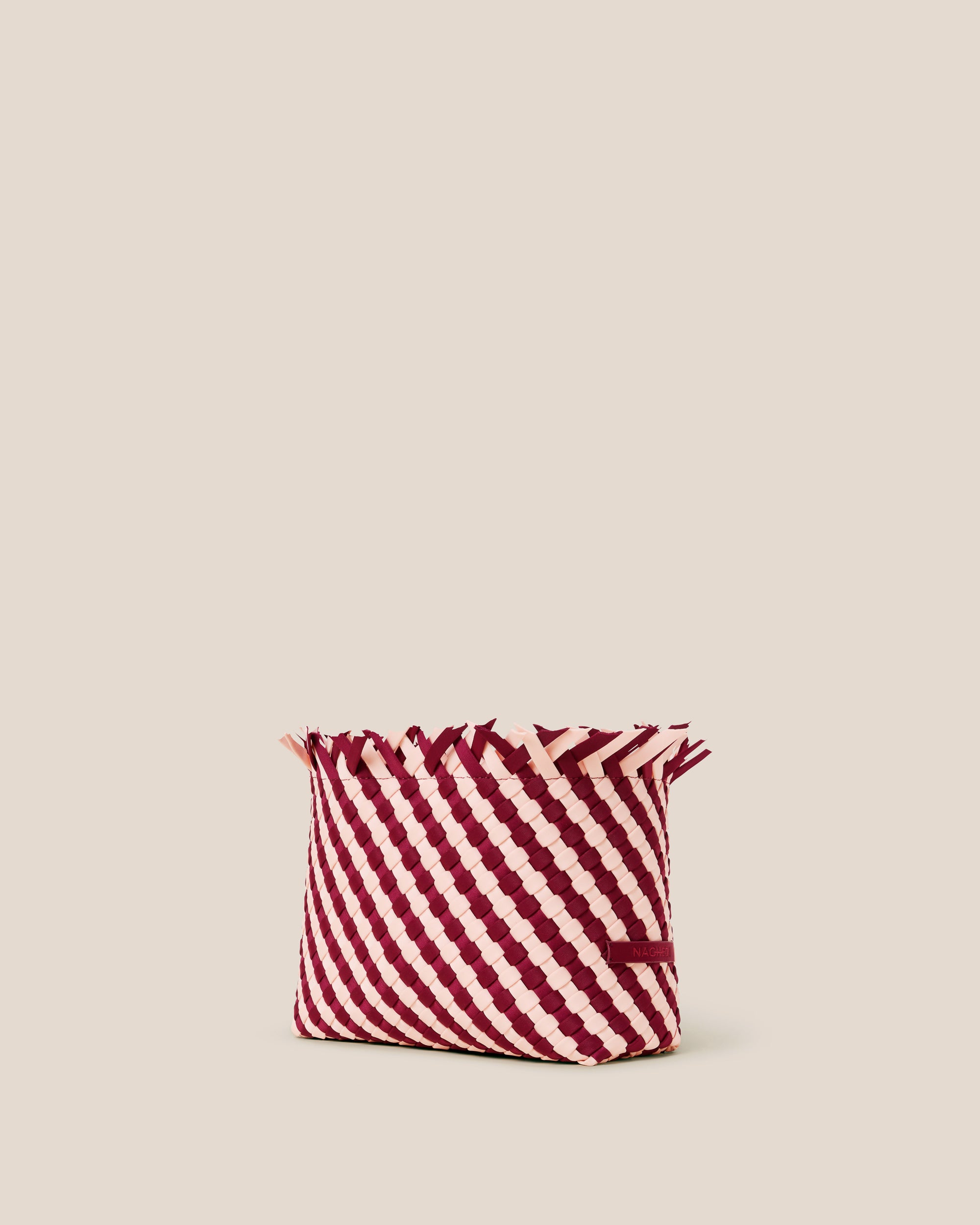 Havana  in Jaipur shown from a side angle, highlighting its handwoven neoprene construction and magnetic snap closure.