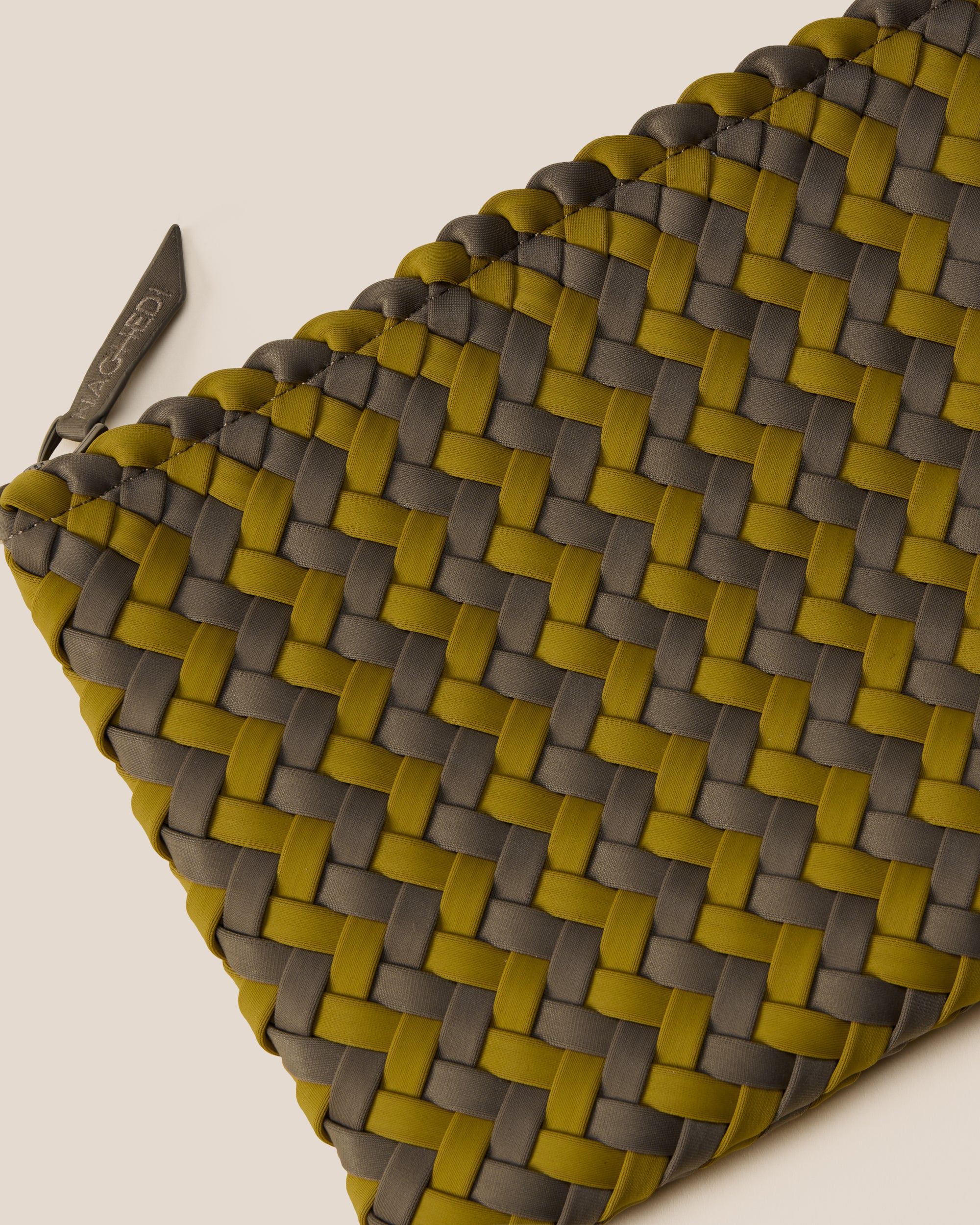 Close-up of included matching woven zippered pouch.