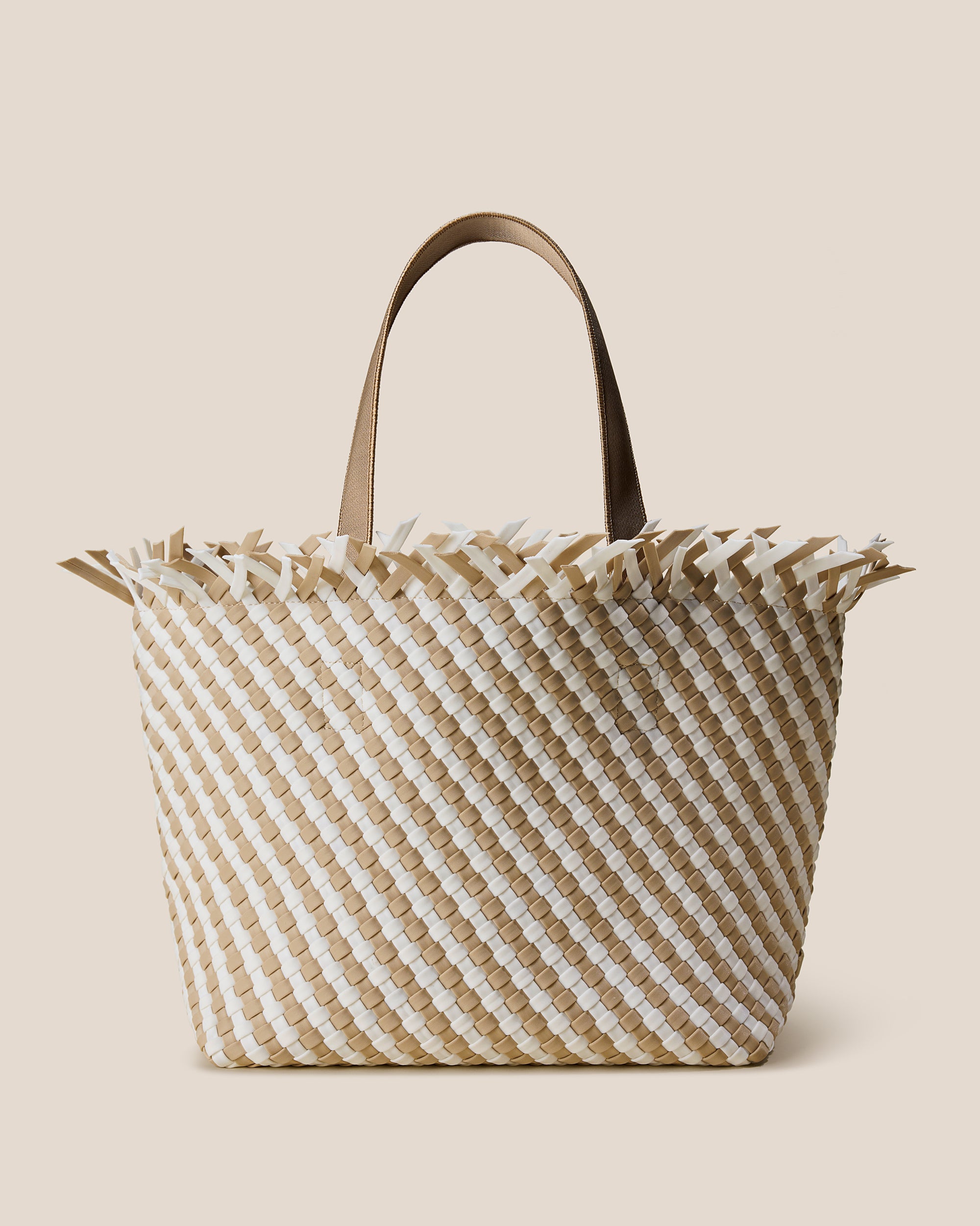 Havana Medium Striped Tote Bag in Almaza, a white and cream tone, in handwoven neoprene featuring an open top with magnetic snap closure, and sleek nylon webbing handles fit over the shoulder.