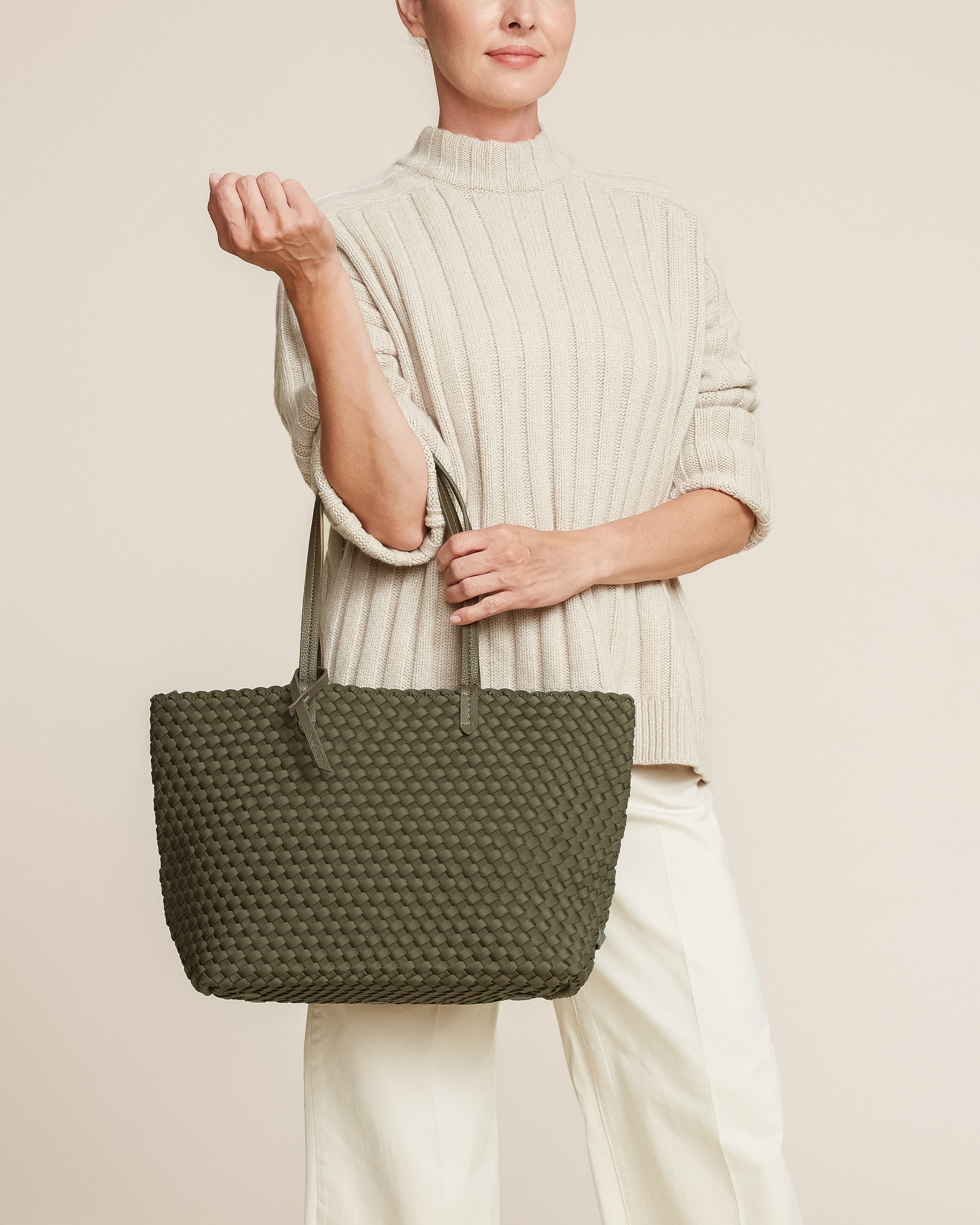 Jetsetter Tote in Olive shown on model to illustrate scale and soft silhouette.