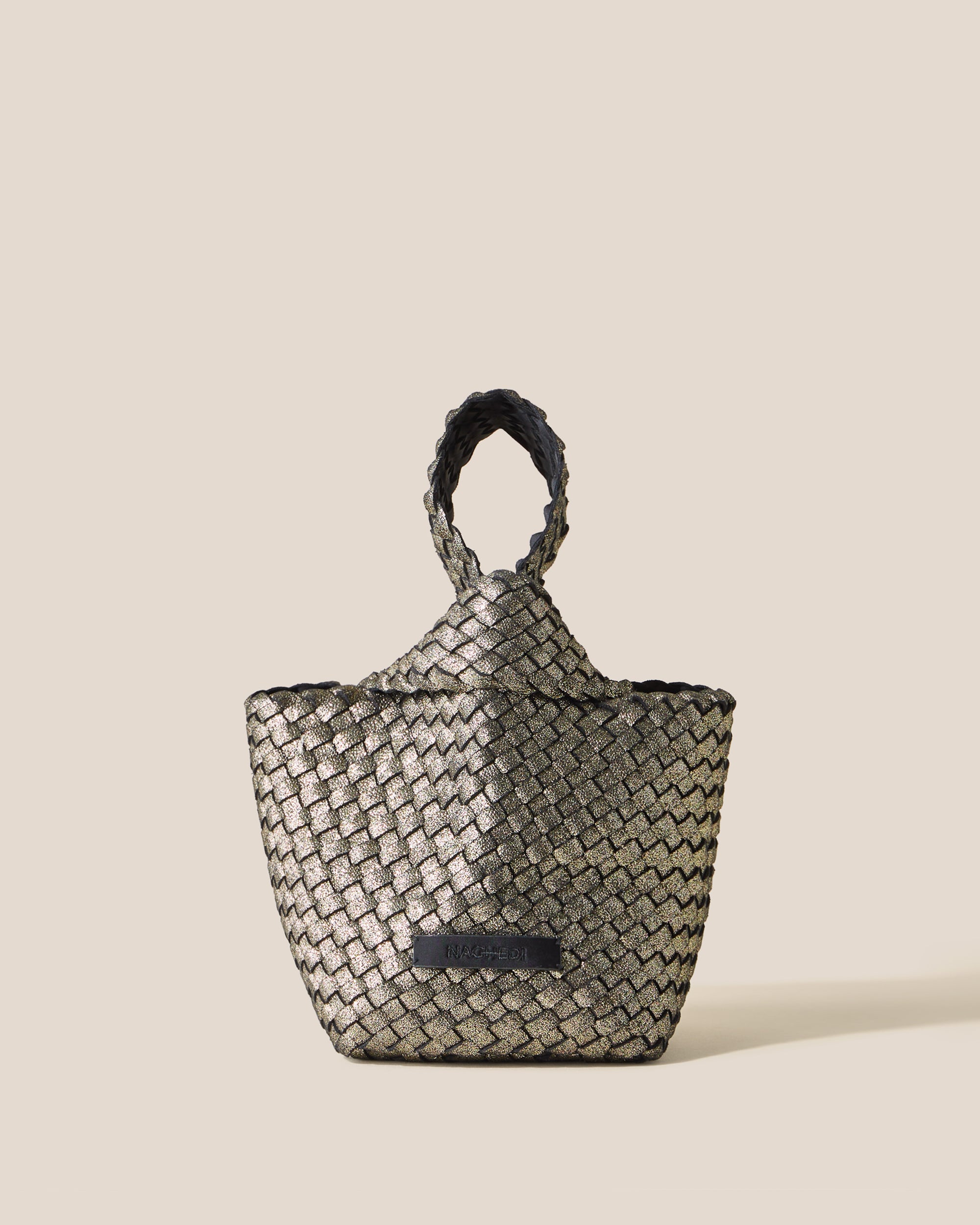 Kyoto Clutch in Etoile, a metallic gold tone, in handwoven neoprene, featuring a secure slide-through loop closure.