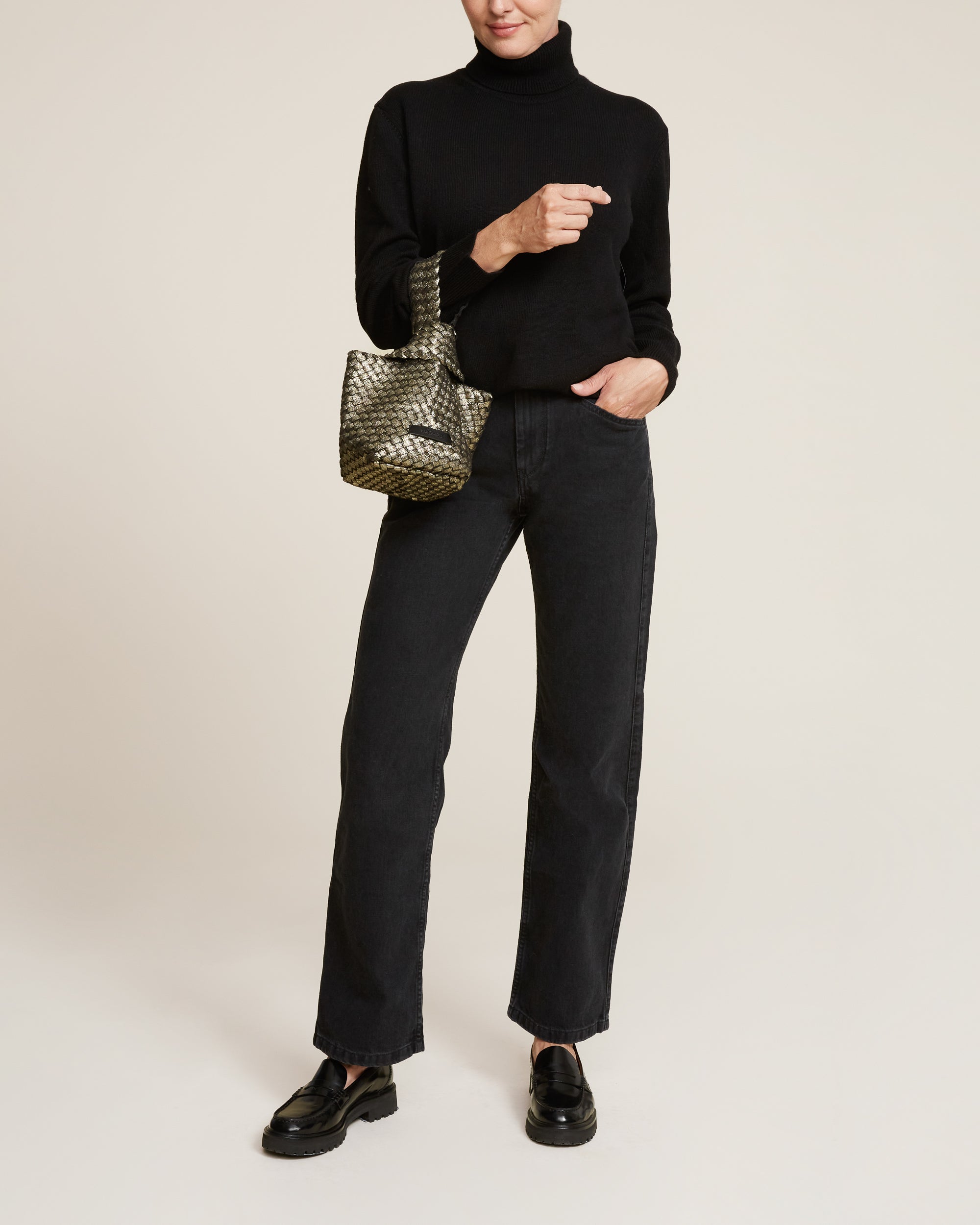 Kyoto Clutch in Etoile shown on model to illustrate scale and soft silhouette.