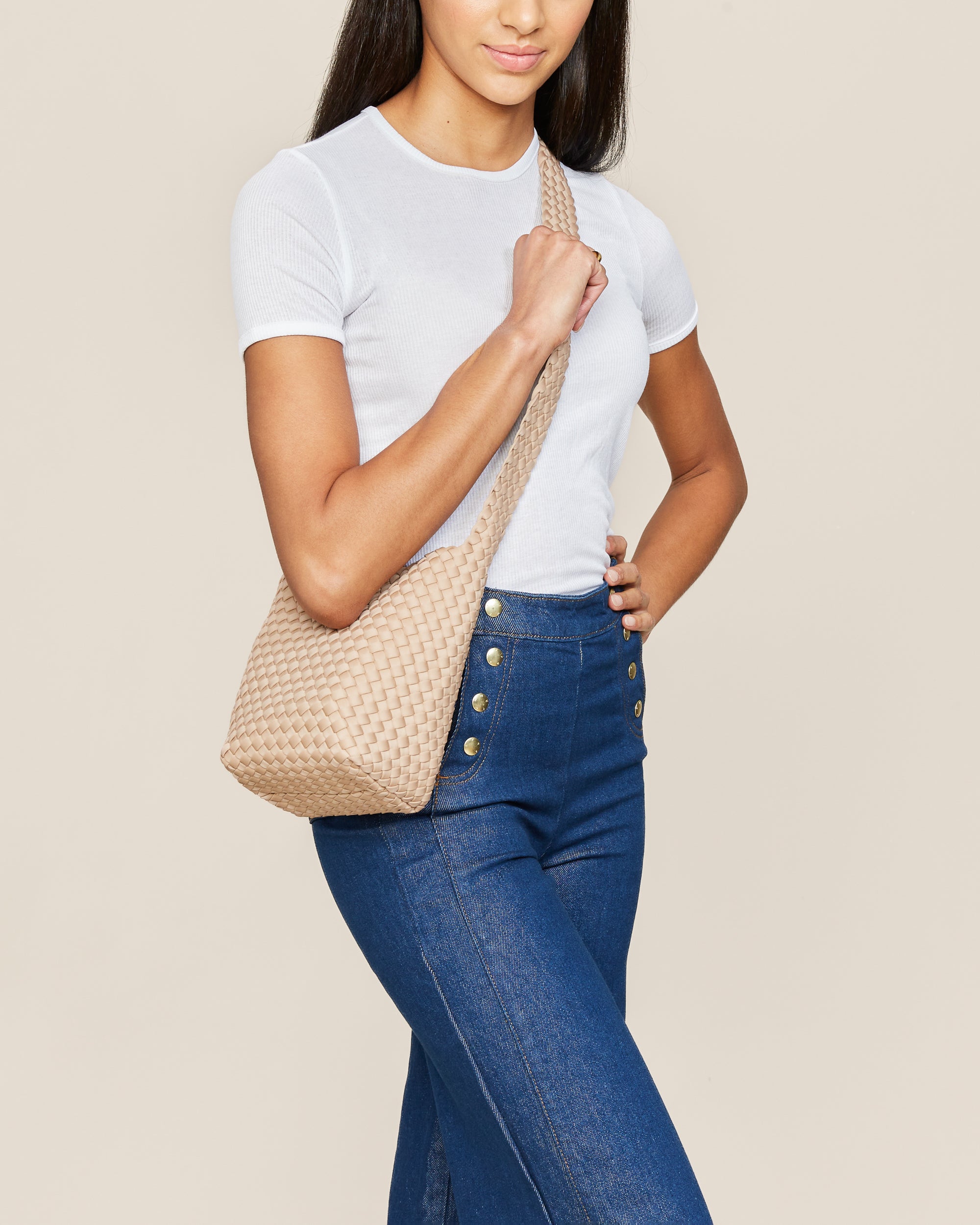 Laguna Crossbody in Camel shown on model to illustrate scale and soft silhouette.