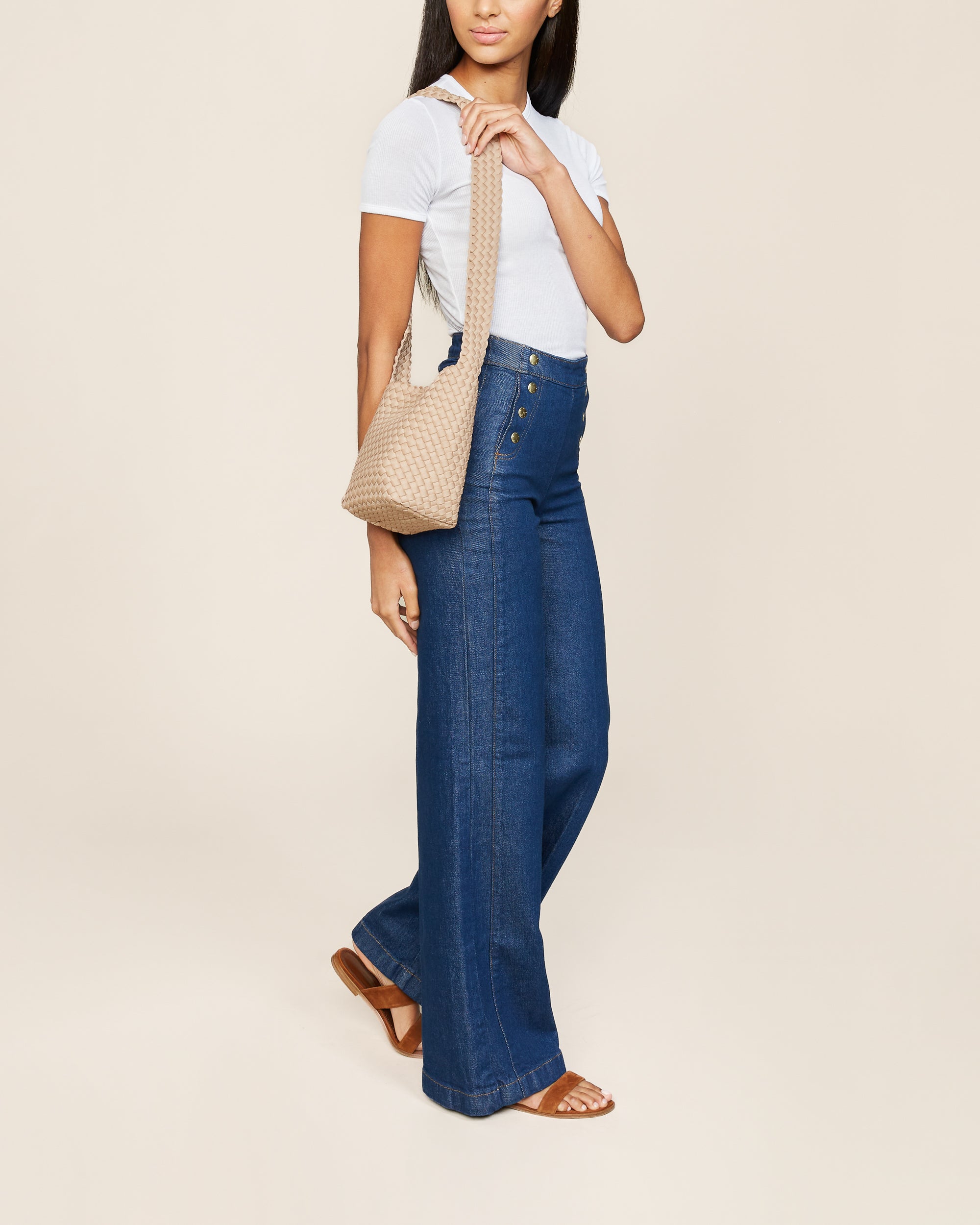 Laguna Crossbody in Camel shown on model to illustrate scale and soft silhouette.