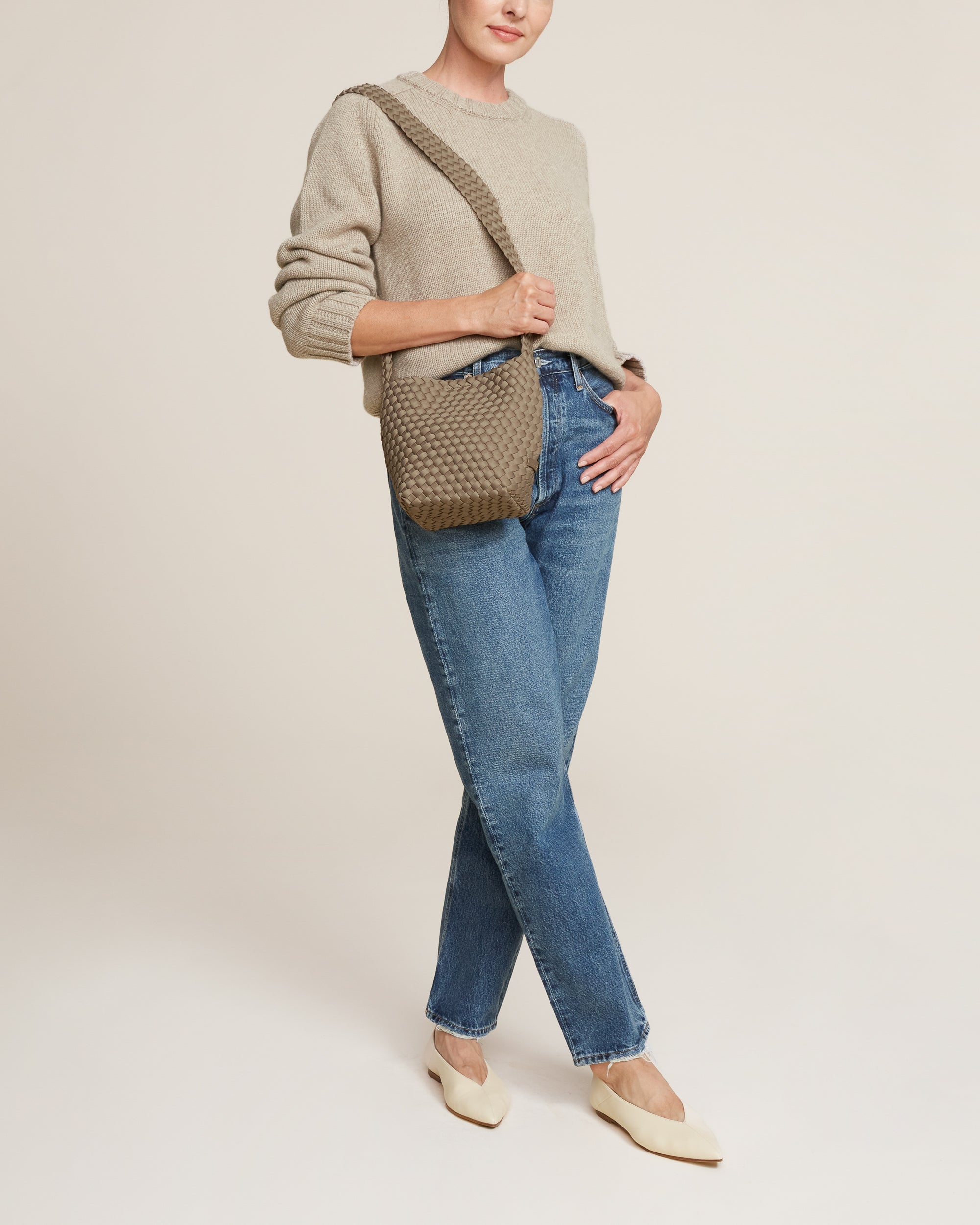 Laguna Crossbody in Cashmere shown on model to illustrate scale and soft silhouette.