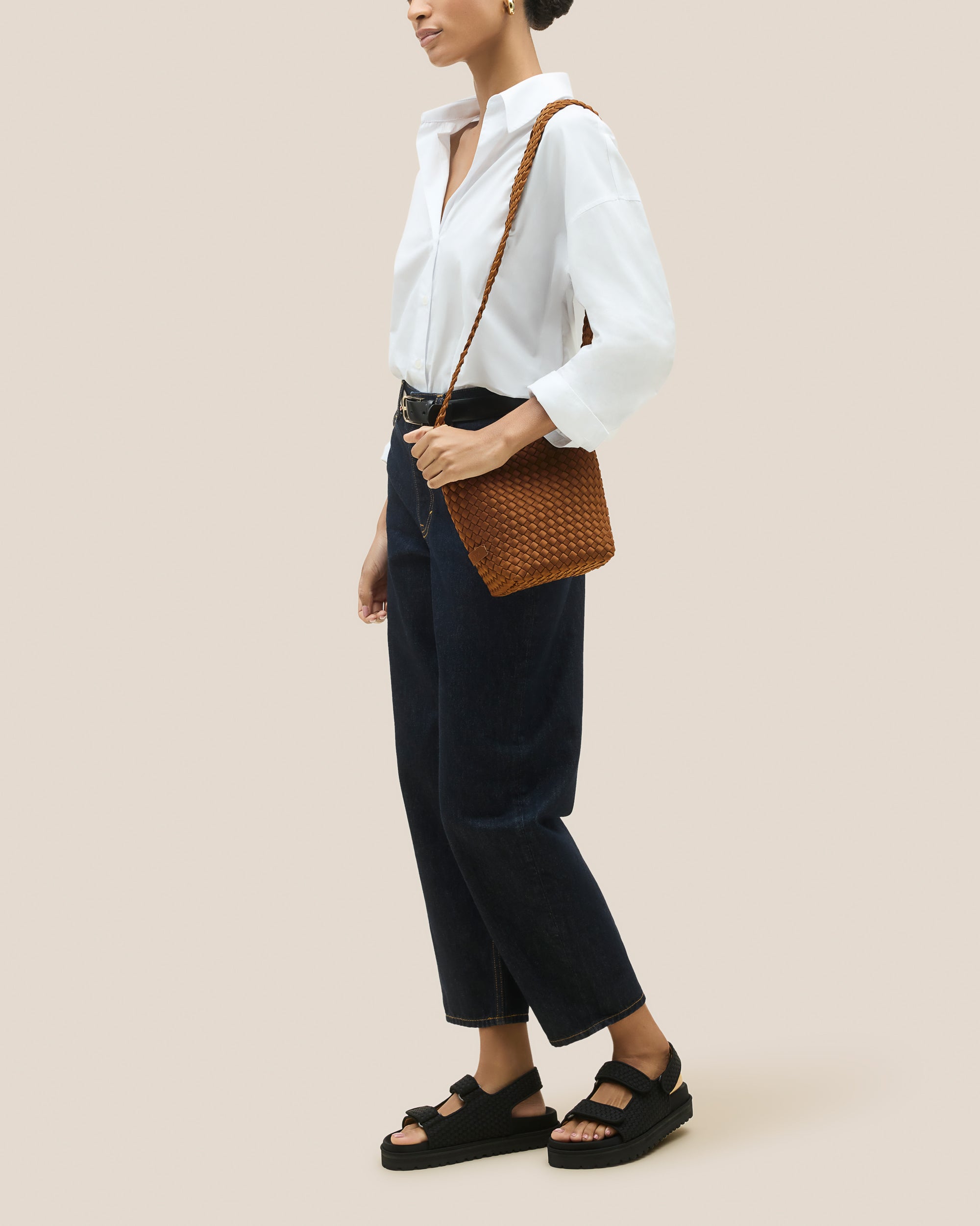 Laguna Crossbody in Teak shown on model to illustrate scale and soft silhouette.