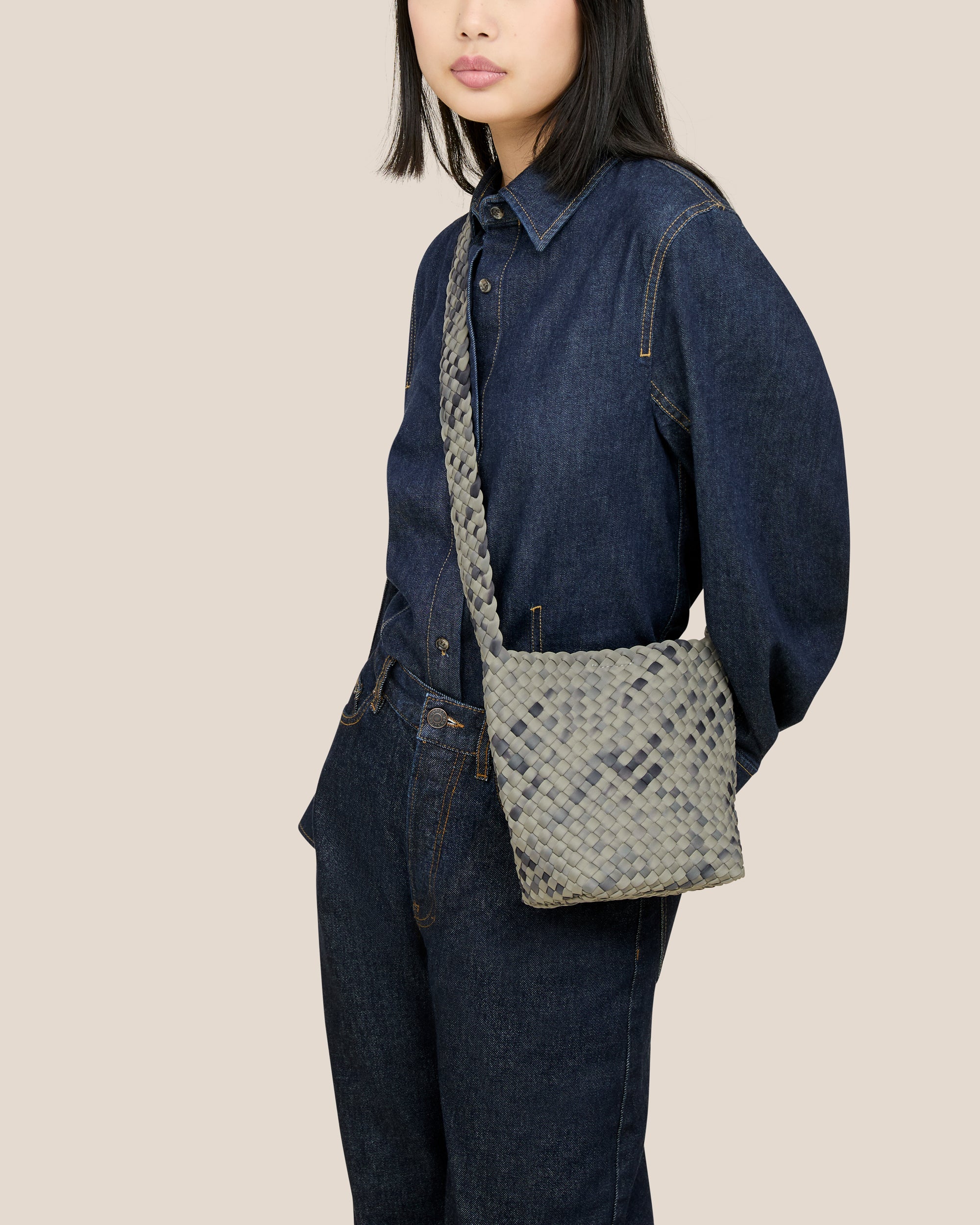 Laguna Crossbody in Neptune shown on model to illustrate scale and soft silhouette.
