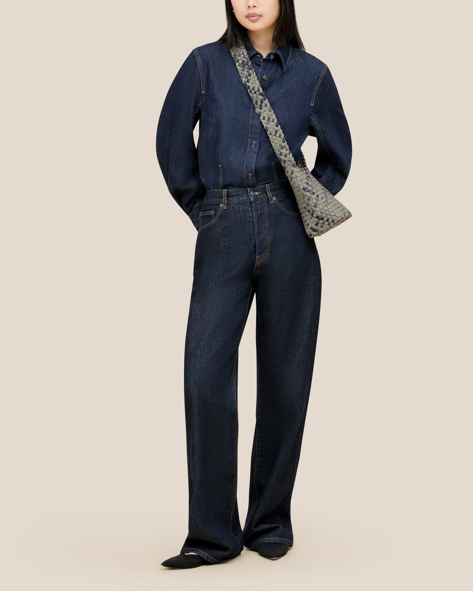Laguna Crossbody in Neptune shown on model to illustrate scale and soft silhouette.
