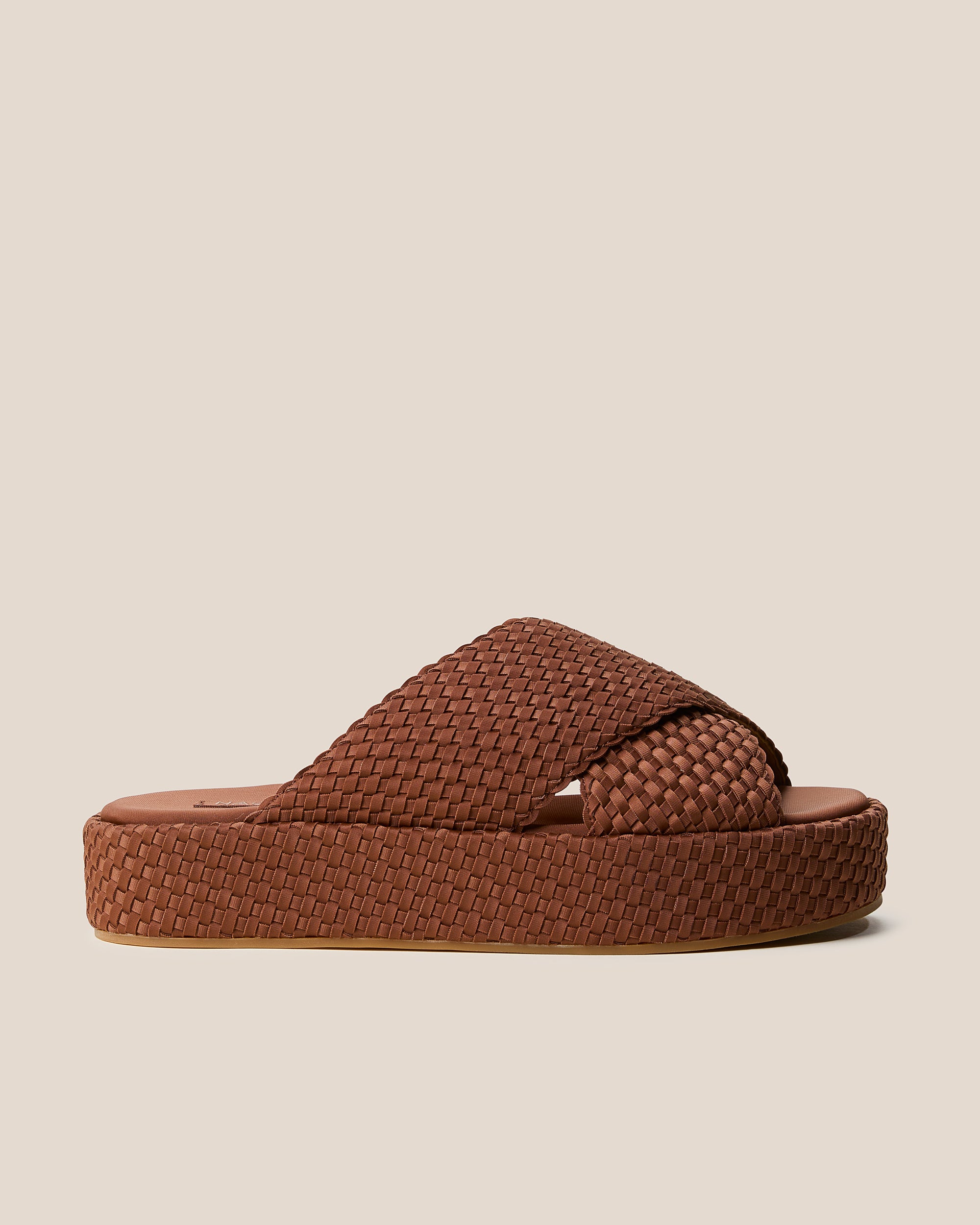 Side view of The Laguna Platform in Adobe, a clay brown tone, featuring an open toe and round silhouette.