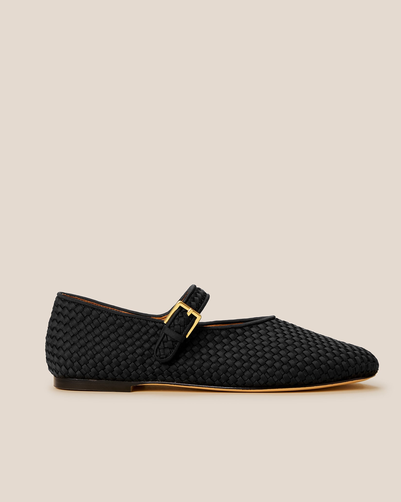 Side view of The Marais Mary Jane in Onyx, a true black tone, featuring a closed toe and round silhouette, featuring an adjustable strap with buckle closure.