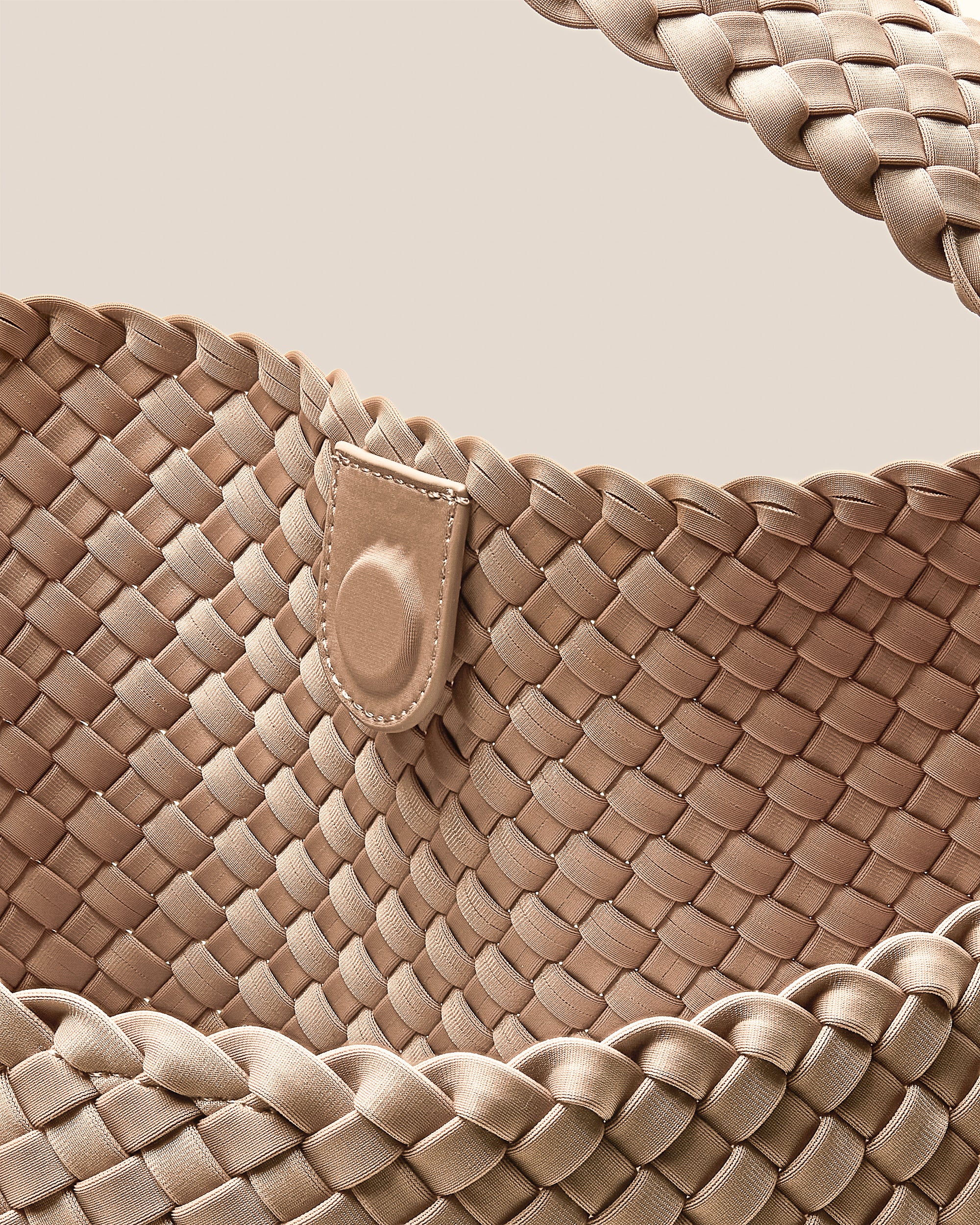 Interior close-up of Nomad Hobo in Camel showing its open top with magnetic snap closure, and unlined interior.