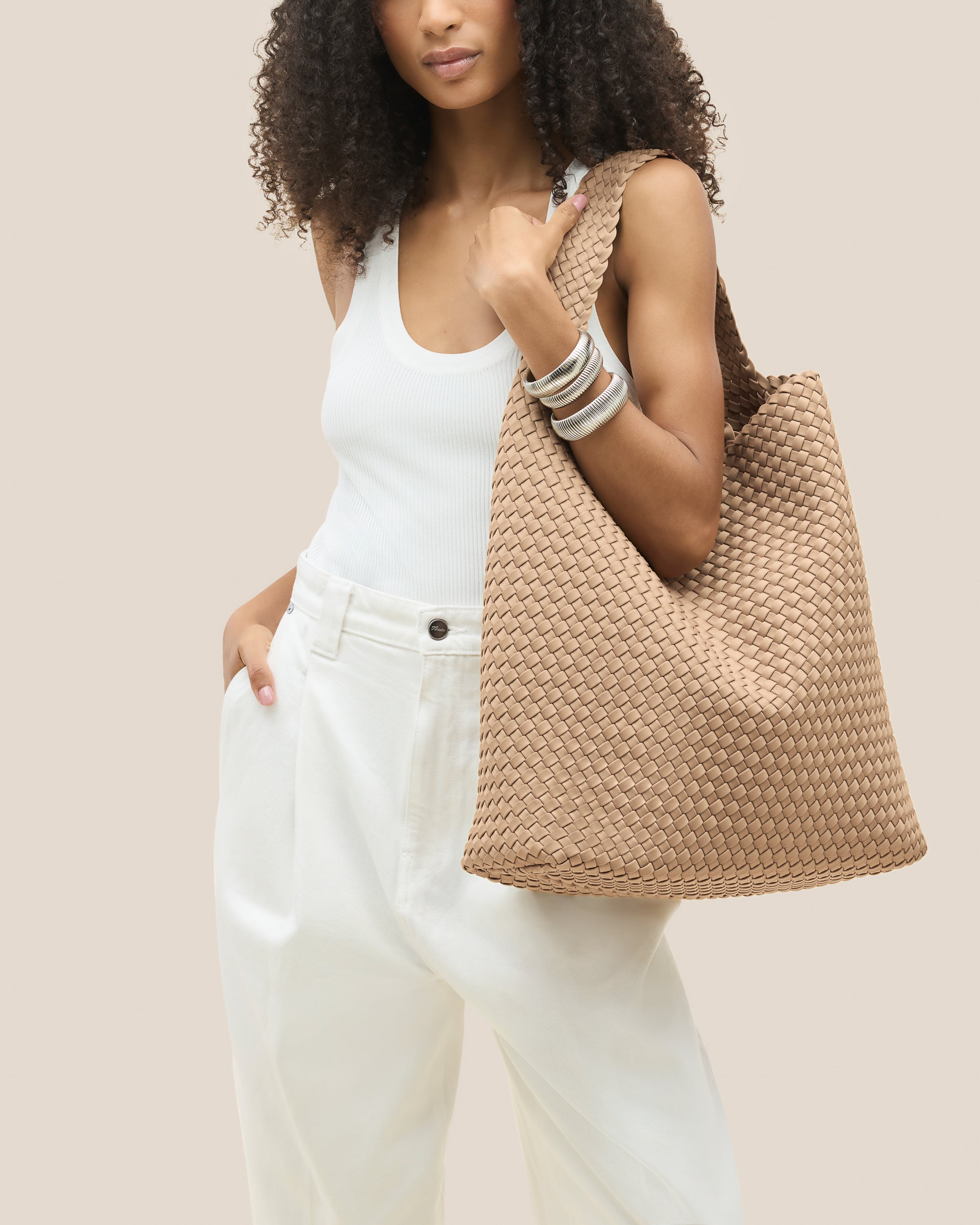 Nomad Hobo in Camel shown on model to illustrate scale and soft silhouette.