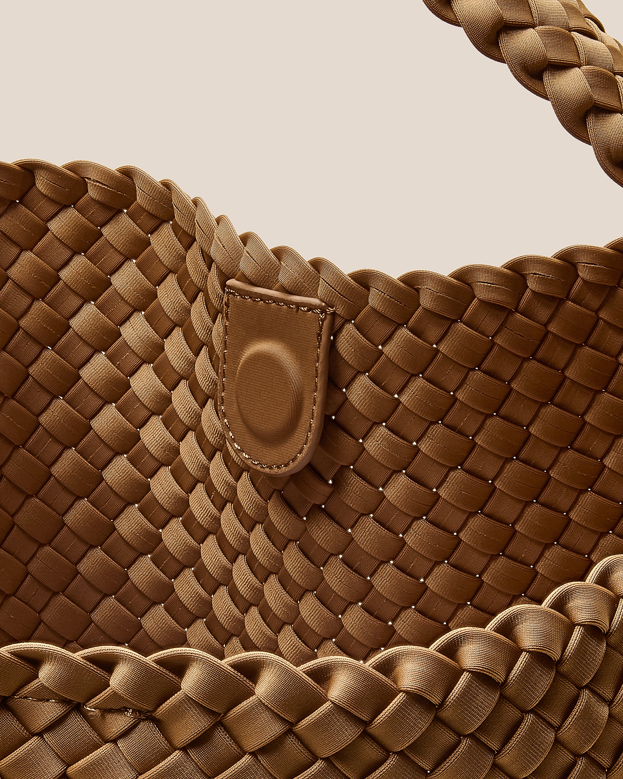 Interior close-up of Nomad Hobo in Montauk showing its open top with magnetic snap closure, and unlined interior.