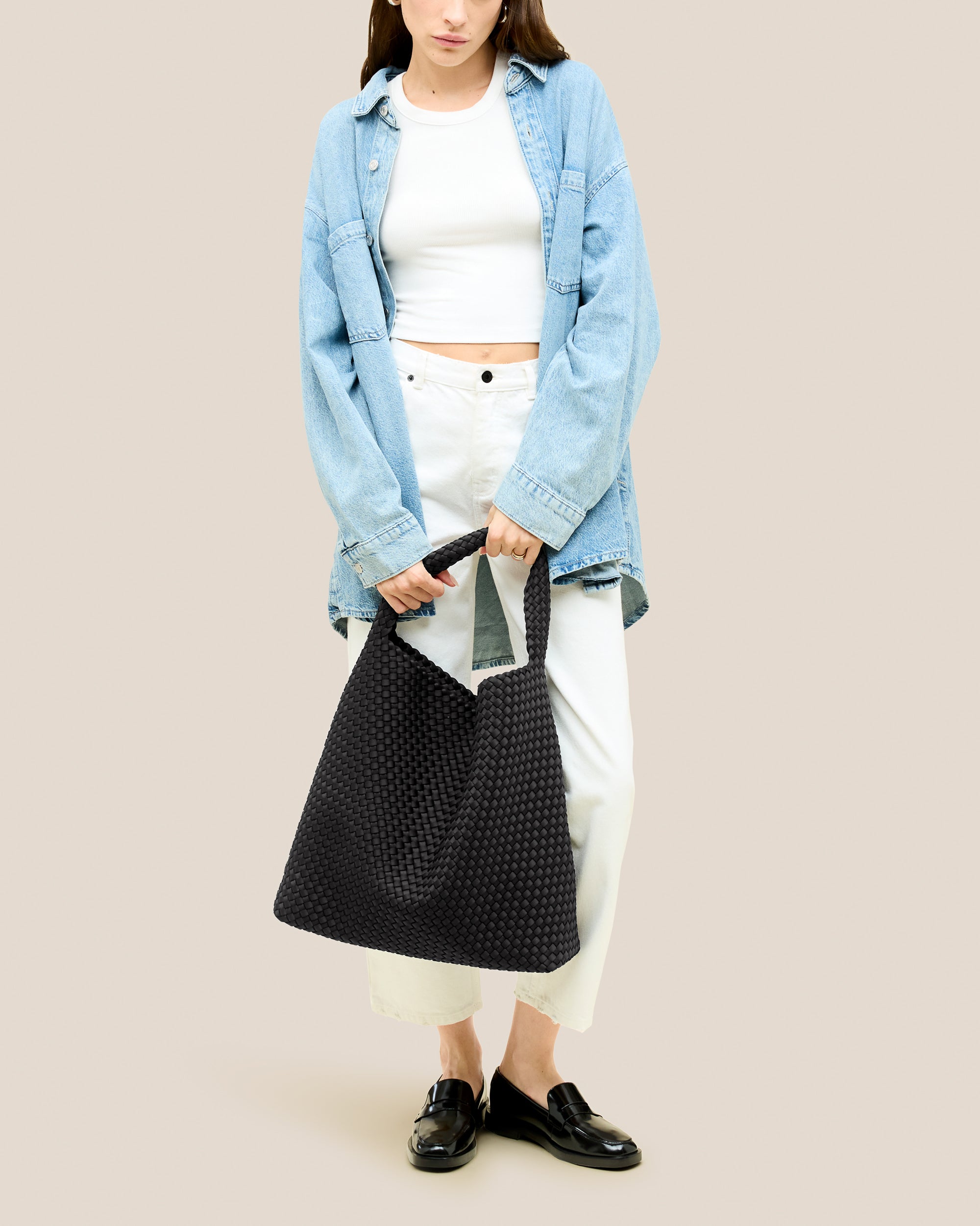 Nomad Hobo in Onyx shown on model to illustrate scale and soft silhouette.