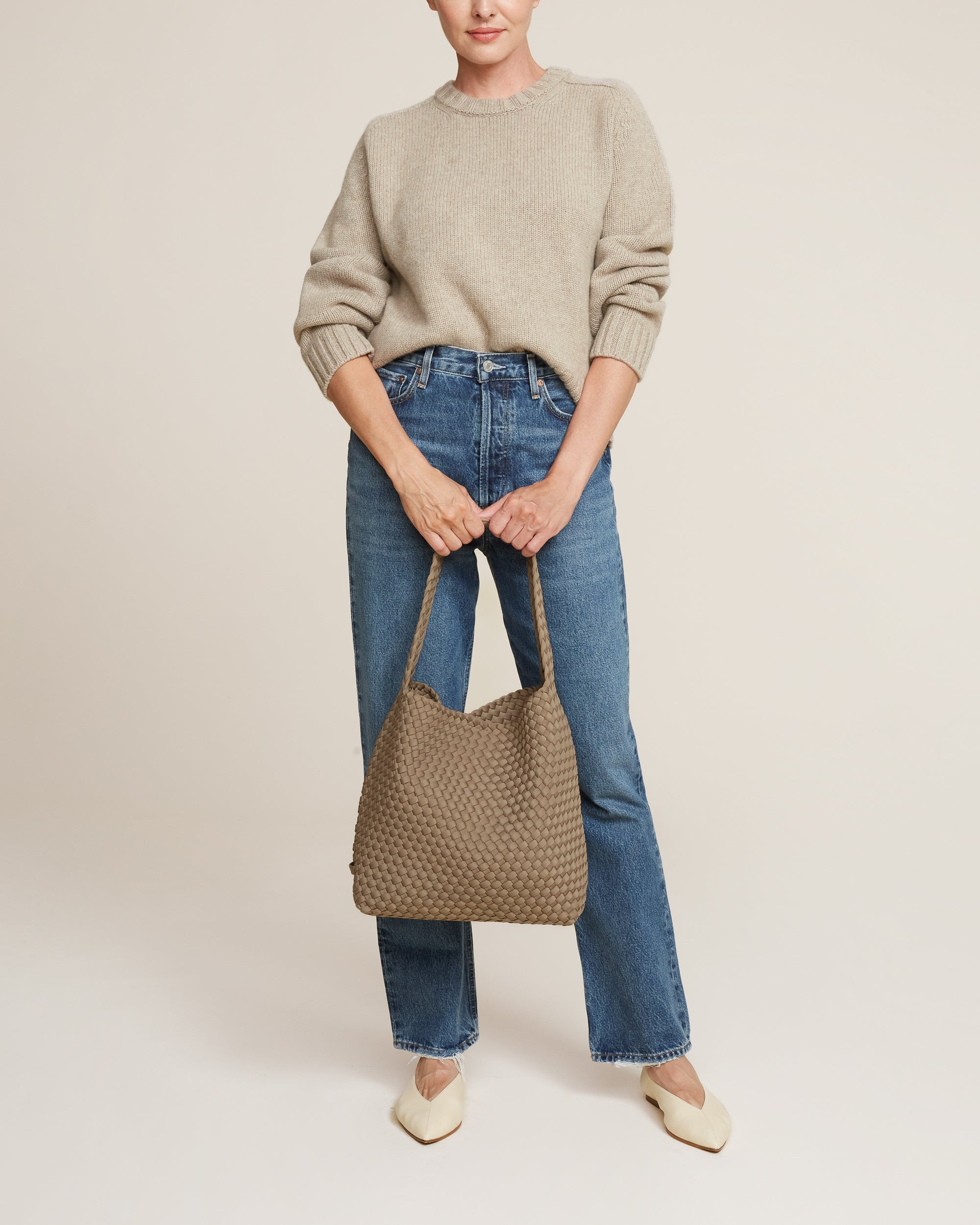 Nomad Hobo in Cashmere shown on model to illustrate scale and soft silhouette.
