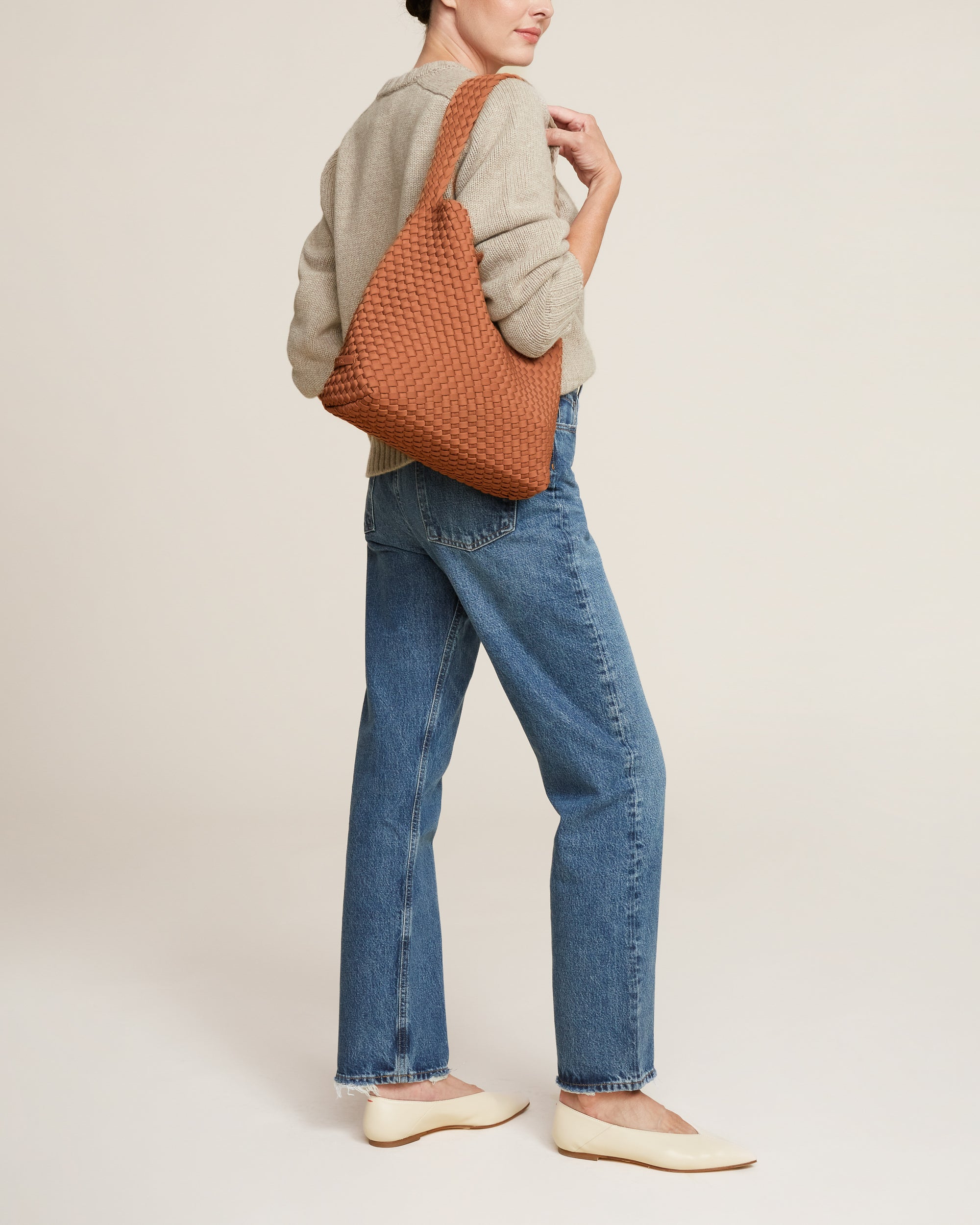 Nomad Hobo in Cocoa shown on model to illustrate scale and soft silhouette.