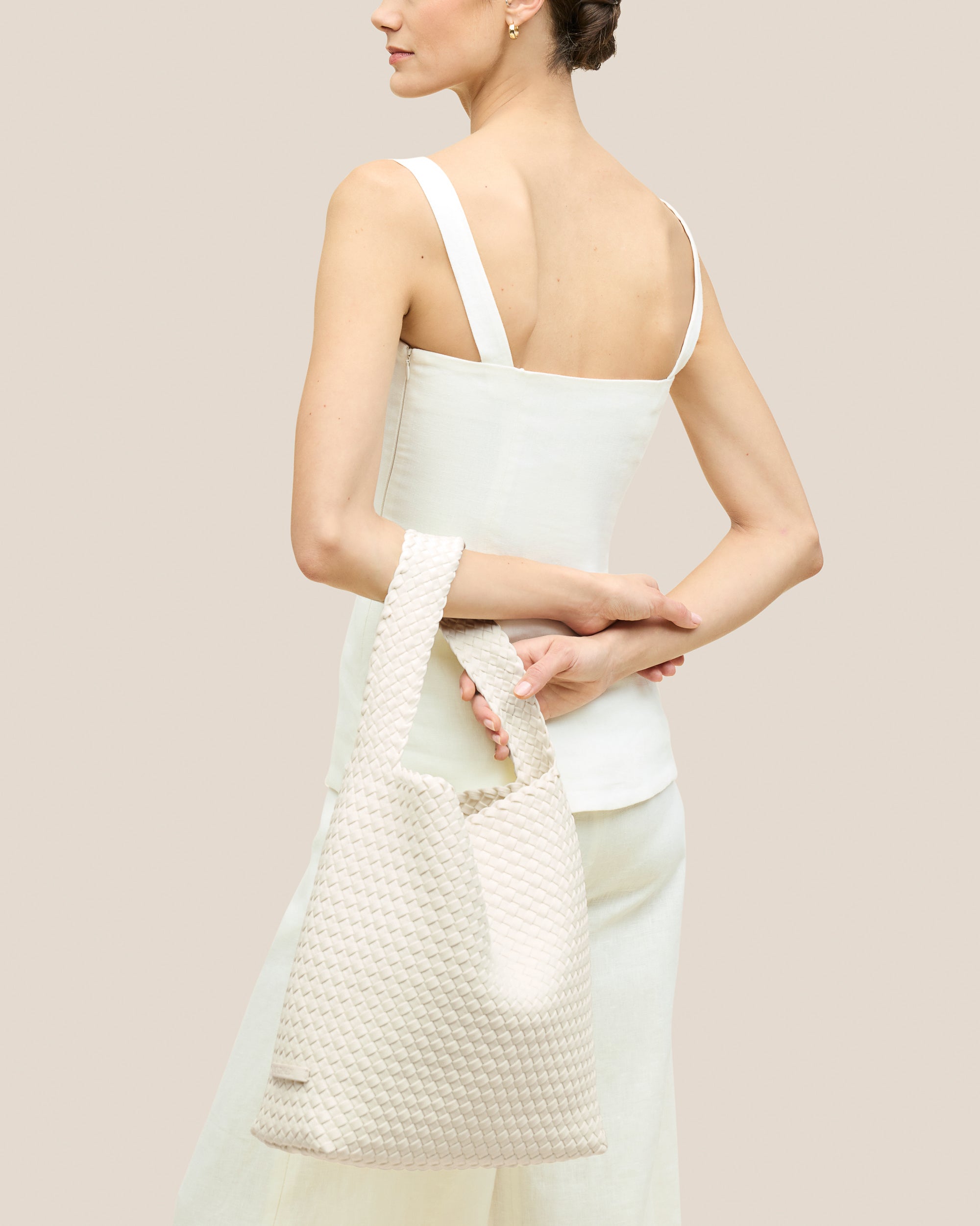 Nomad Hobo in Jasmine shown on model to illustrate scale and soft silhouette.