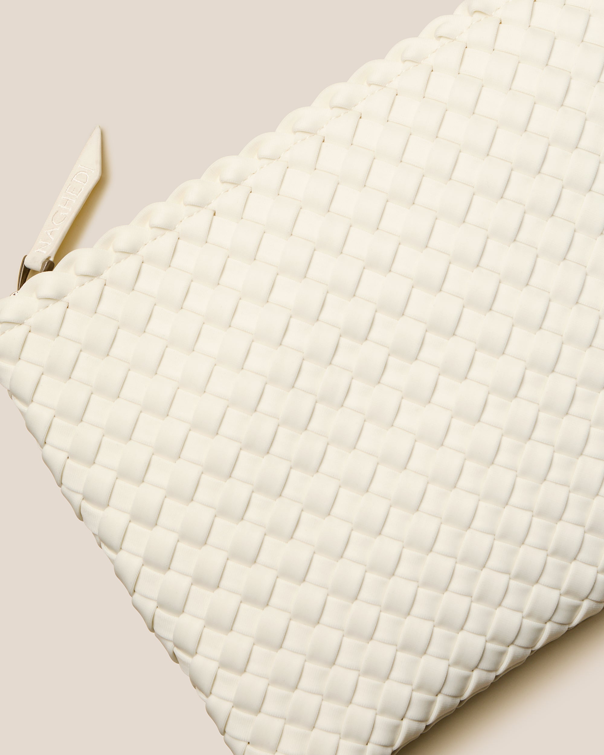 Close-up of included matching woven zippered pouch.