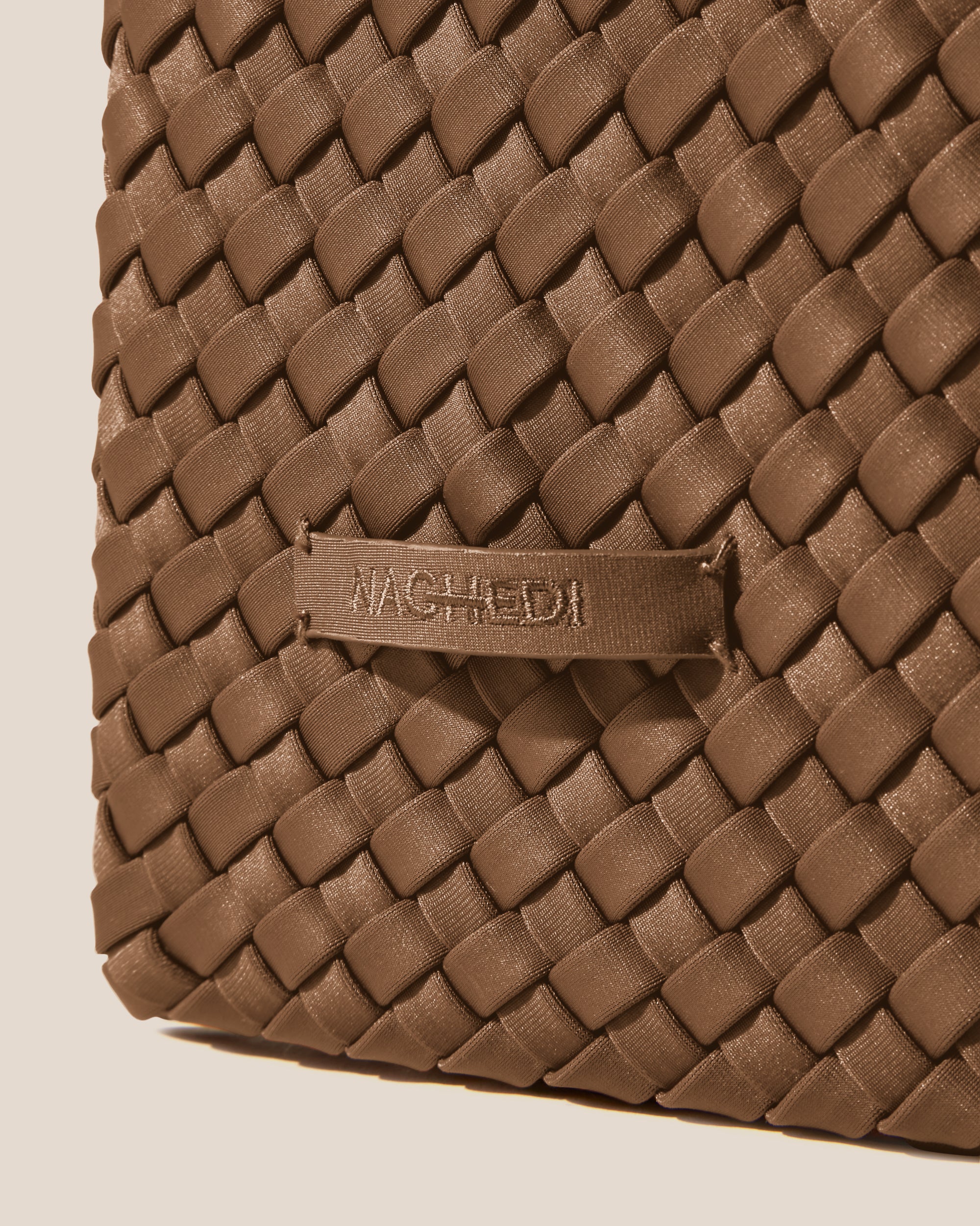 Close-up of stamped NAGHEDI logo on Nomad Hobo in Mink.