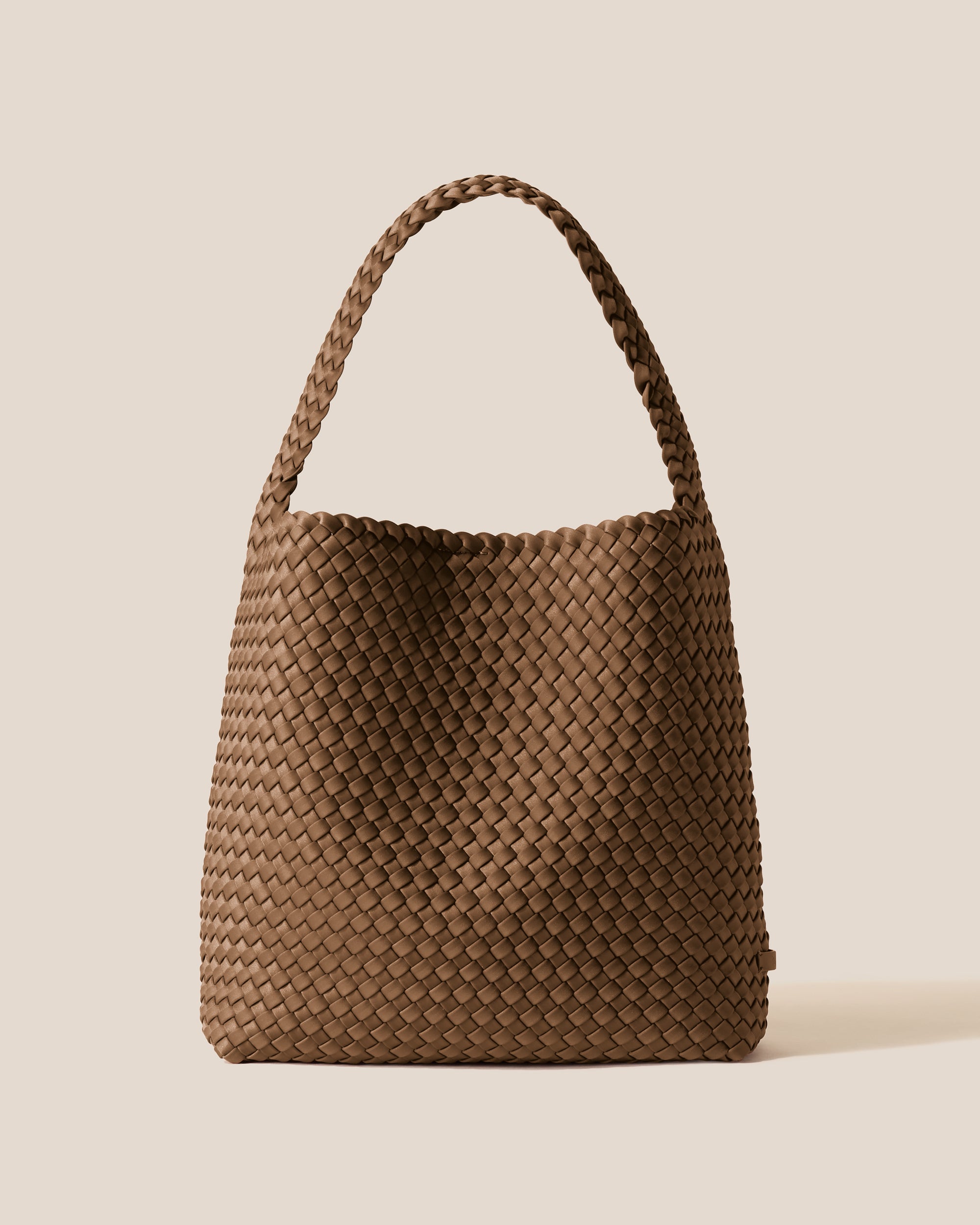 Nomad Hobo in Mink, a brown tone, in handwoven neoprene, featuring an open top with magnetic snap closure, and handwoven shoulder strap lays comfortably flat.