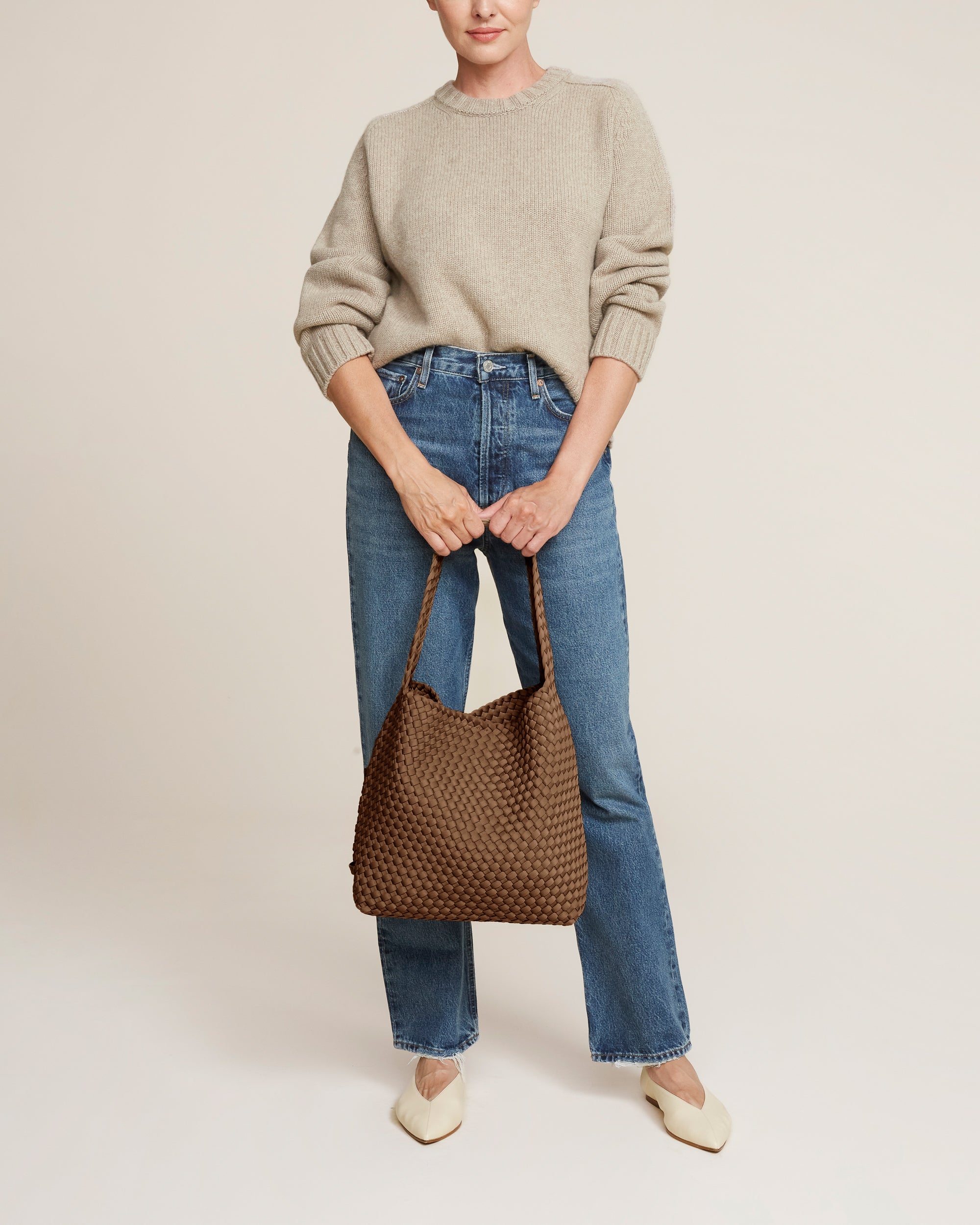 Nomad Hobo in Mink shown on model to illustrate scale and soft silhouette.