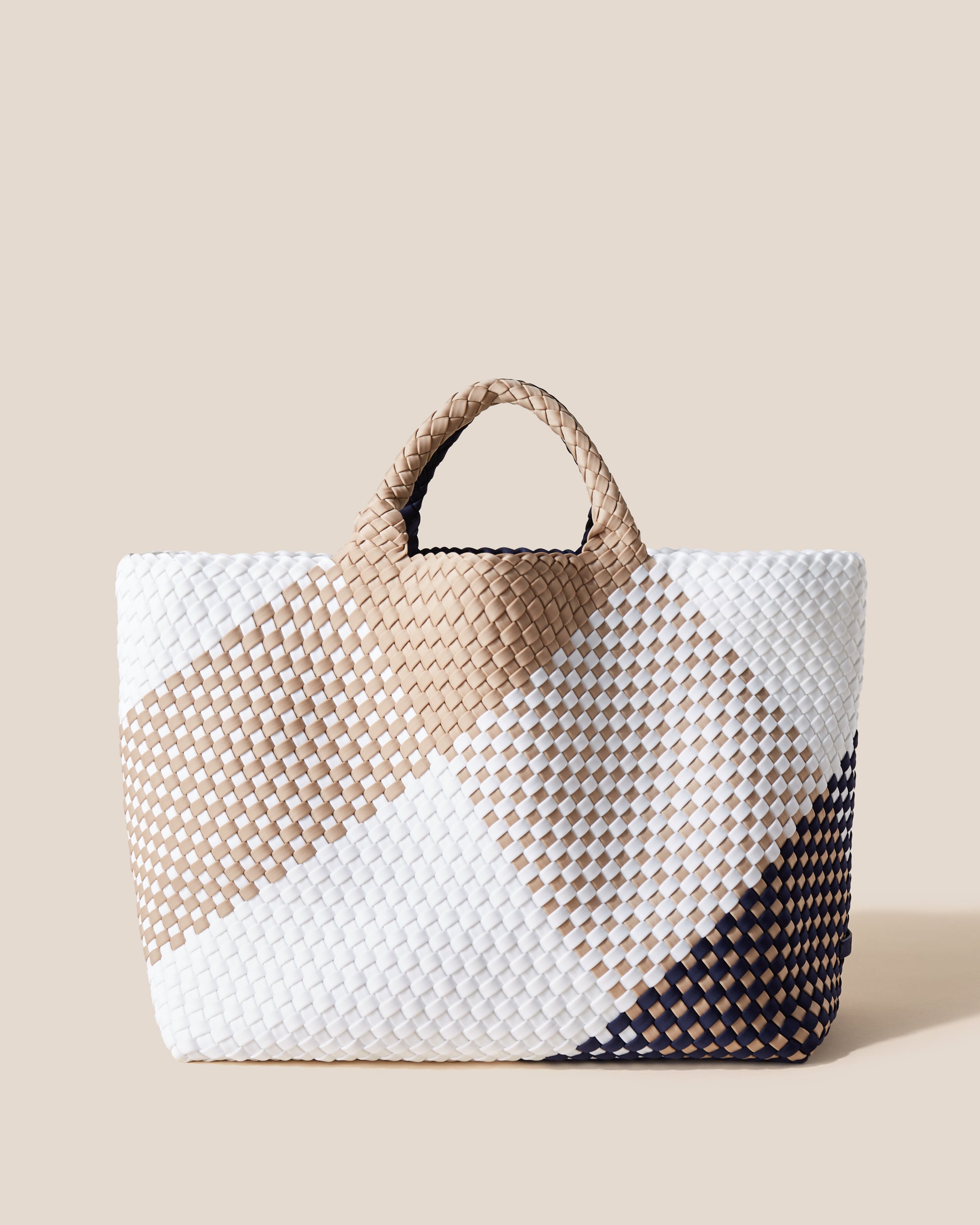 St. Barths Tote in Somerset, a camel brown, navy and white tone, in handwoven neoprene, featuring an open top, and woven top handles.