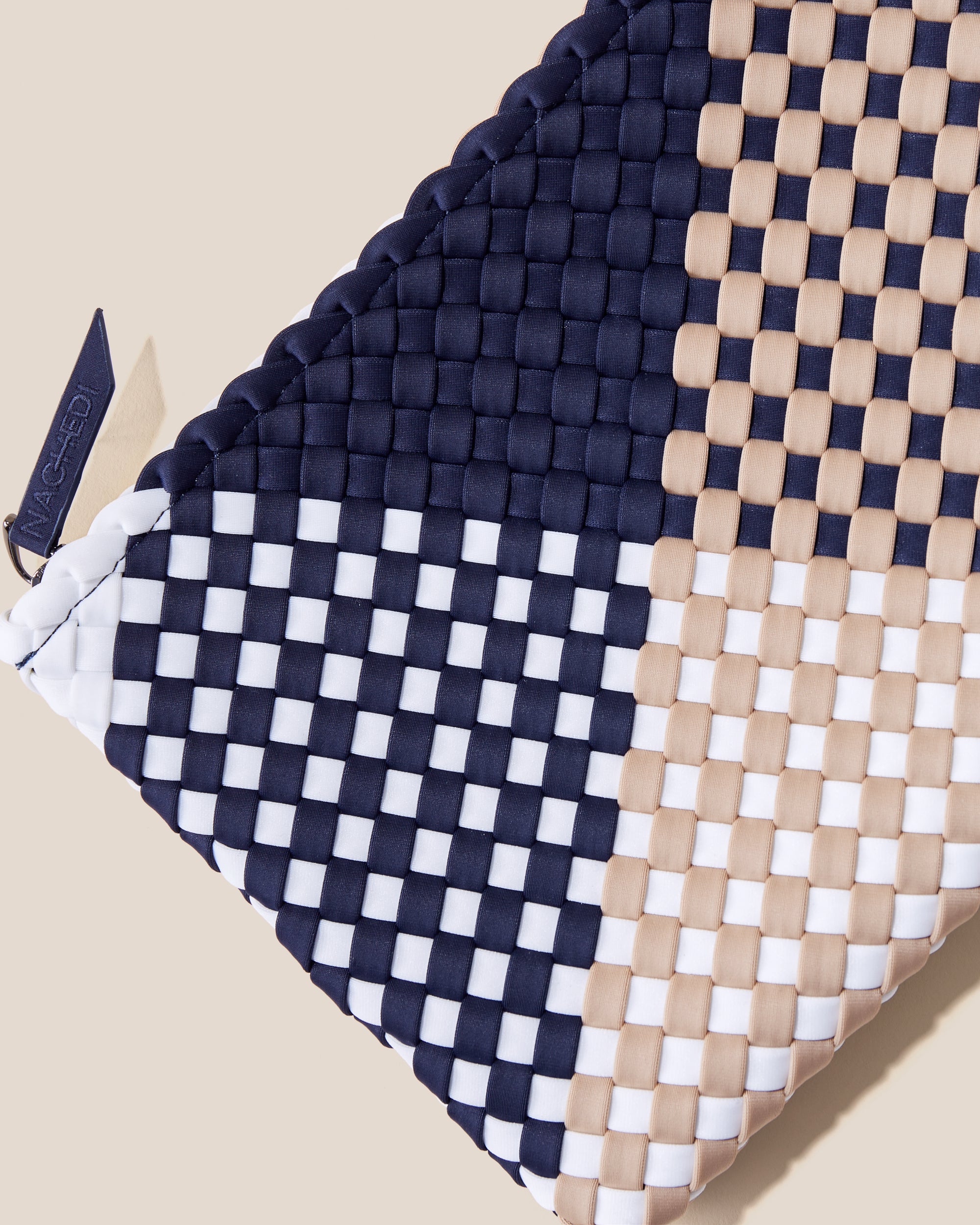 Close-up of included matching woven zippered pouch.