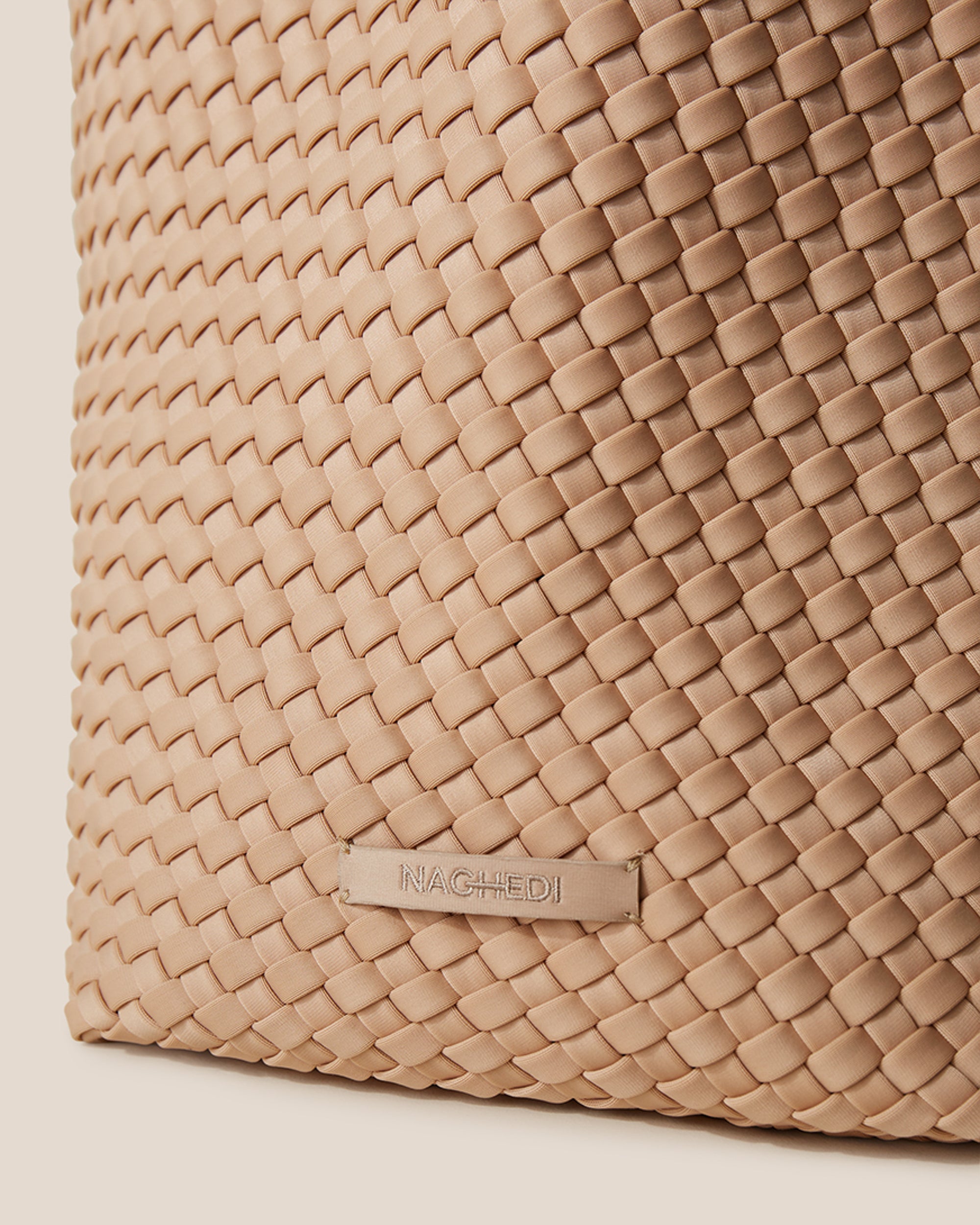 Close-up of stamped NAGHEDI logo on St. Barths Tote in Camel.