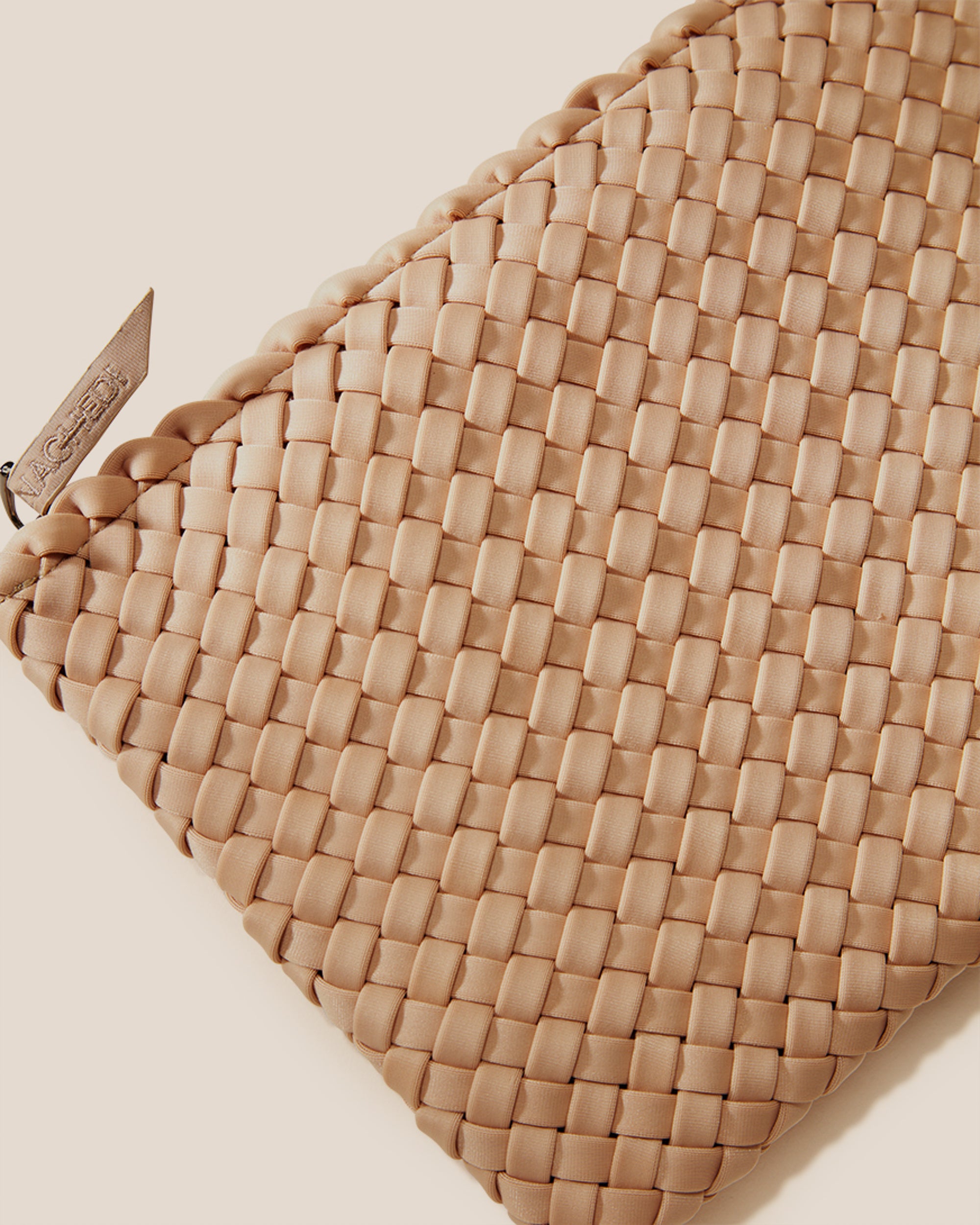 Close-up of included matching woven zippered pouch.