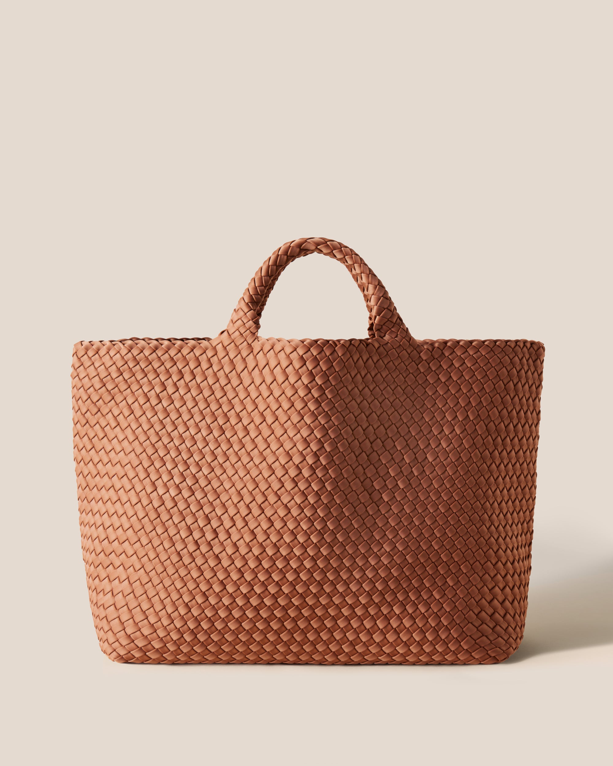 St. Barths Tote in Cocoa, a mocha brown tone, in handwoven neoprene, featuring an open top, and woven top handles.