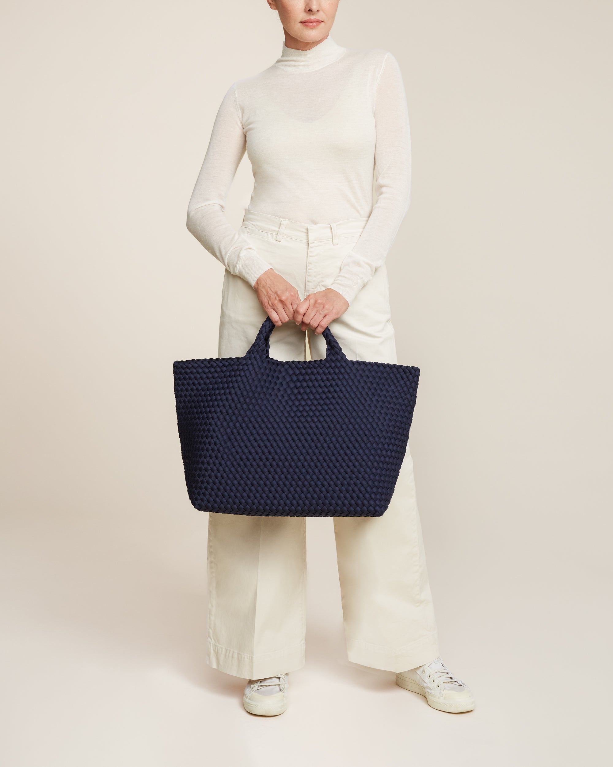 St. Barths Tote in Ink Blue shown on model to illustrate scale and soft silhouette.