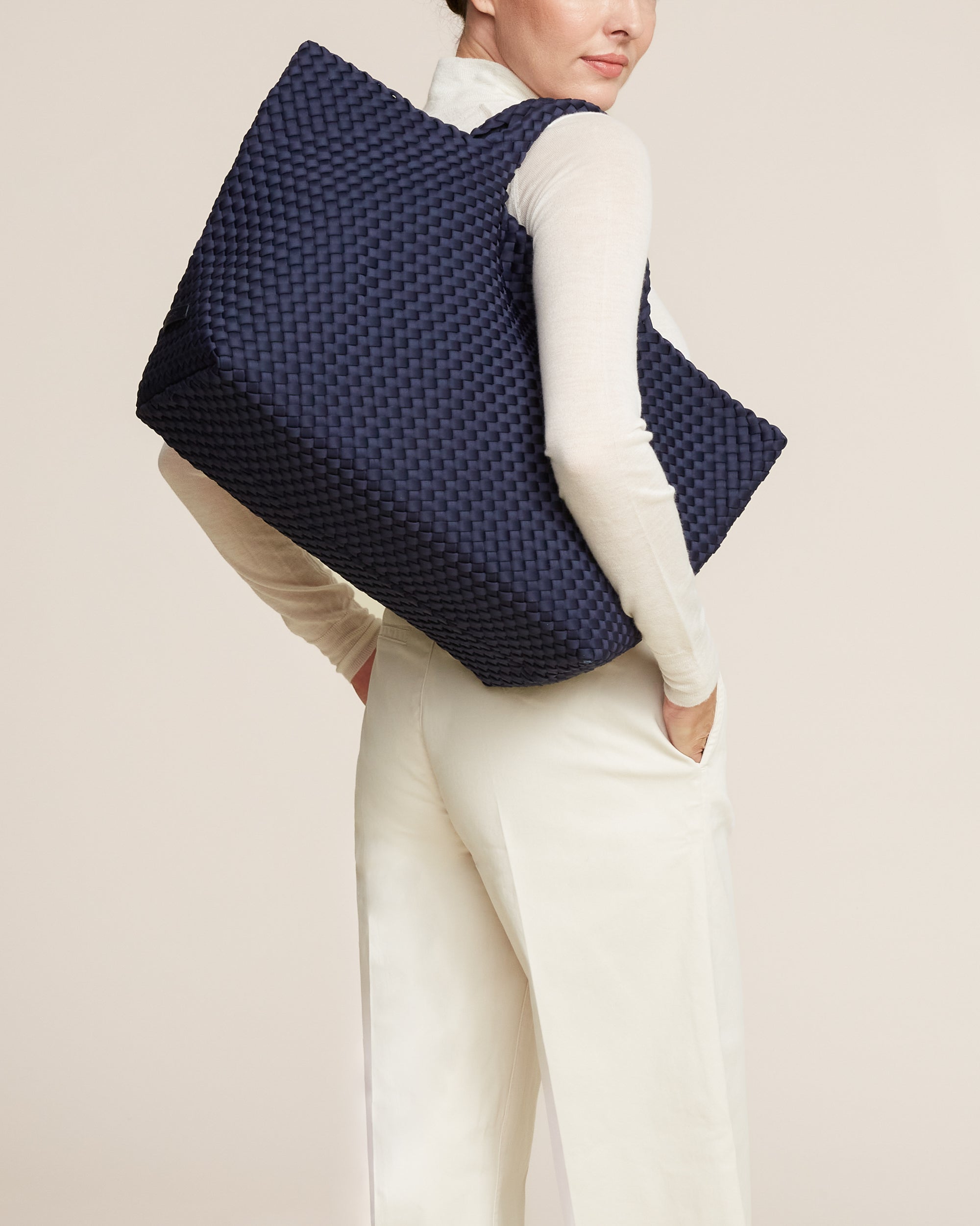 St. Barths Tote in Ink Blue shown on model to illustrate scale and soft silhouette.