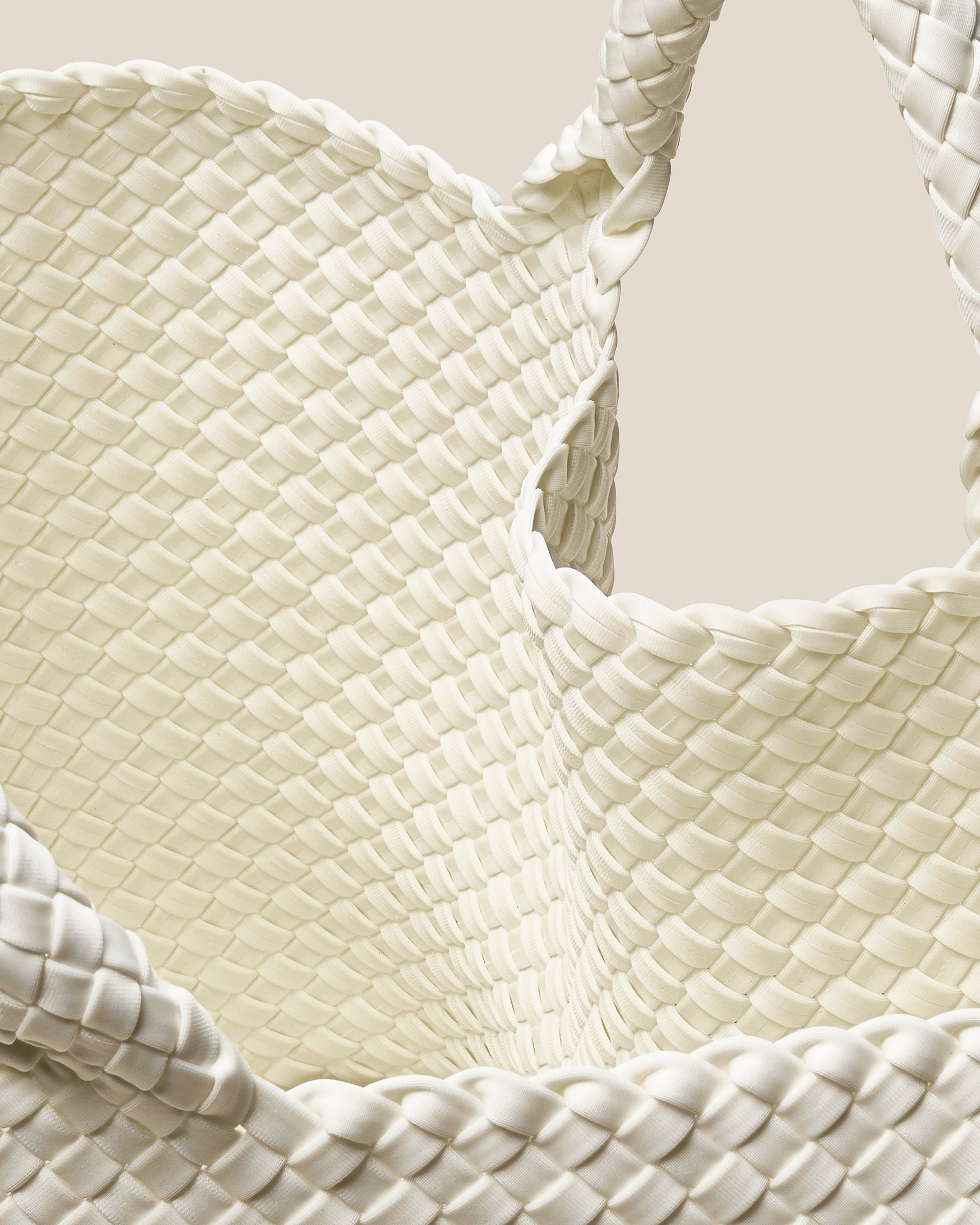 Interior close-up of St. Barths Tote in Jasmine showing its open top, and unlined interior.