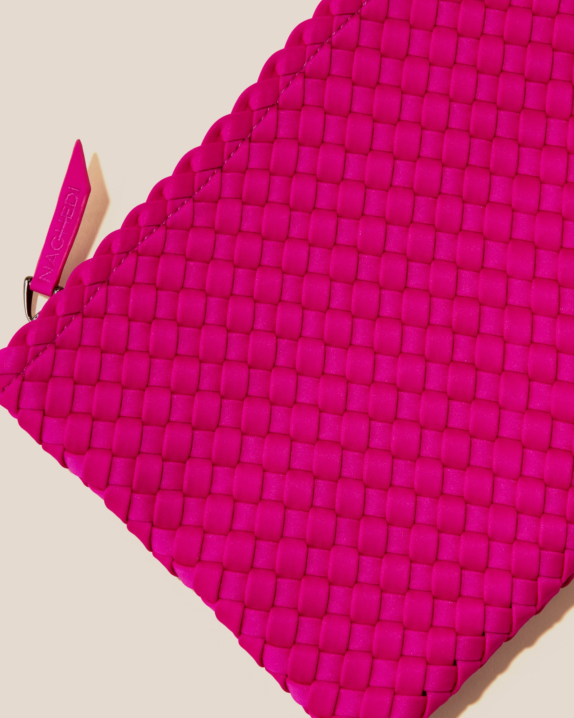 Close-up of included matching woven zippered pouch.