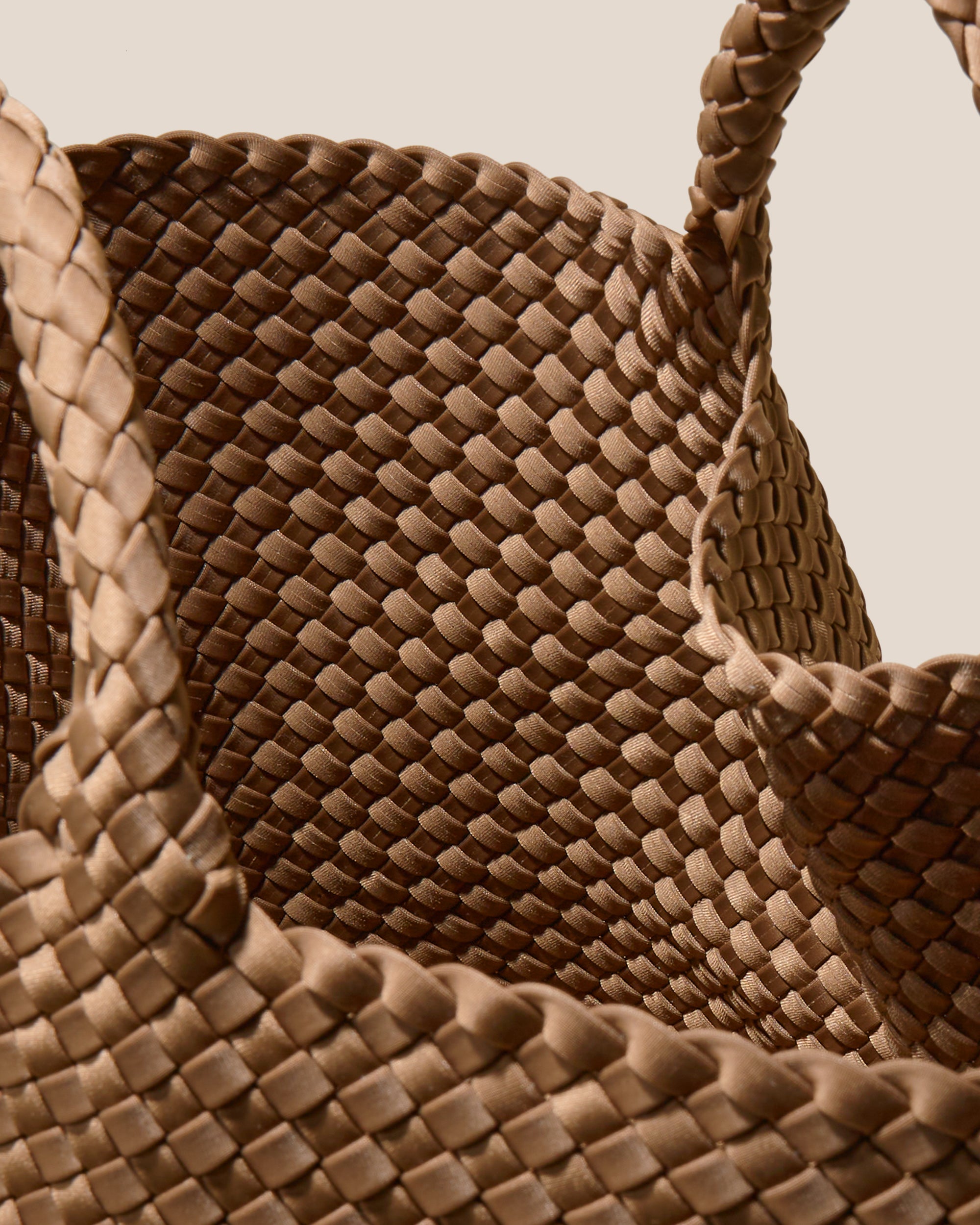 Interior close-up of St. Barths Tote in Mink showing its open top, and unlined interior.