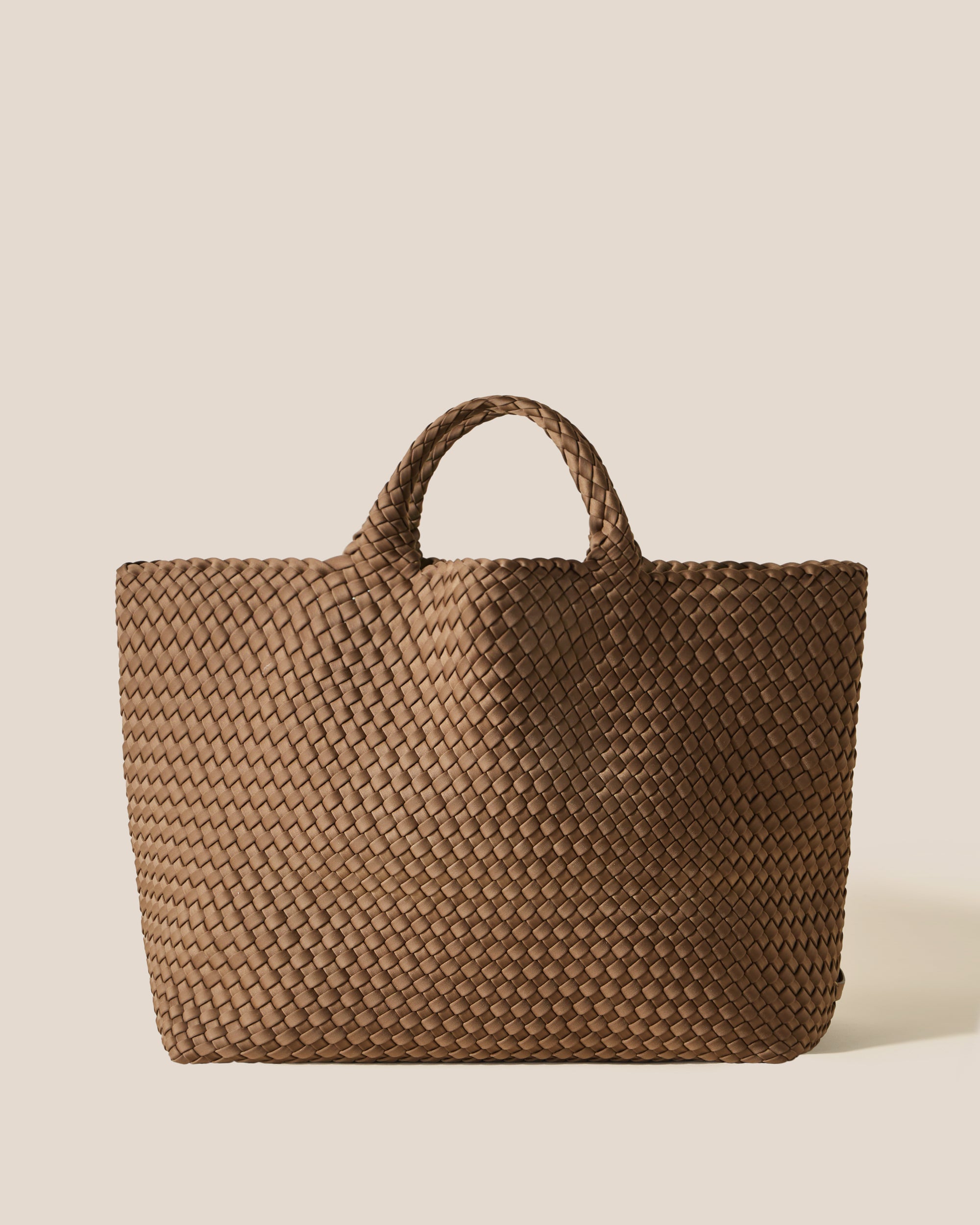 St. Barths Tote in Mink, a brown tone, in handwoven neoprene, featuring an open top, and woven top handles.