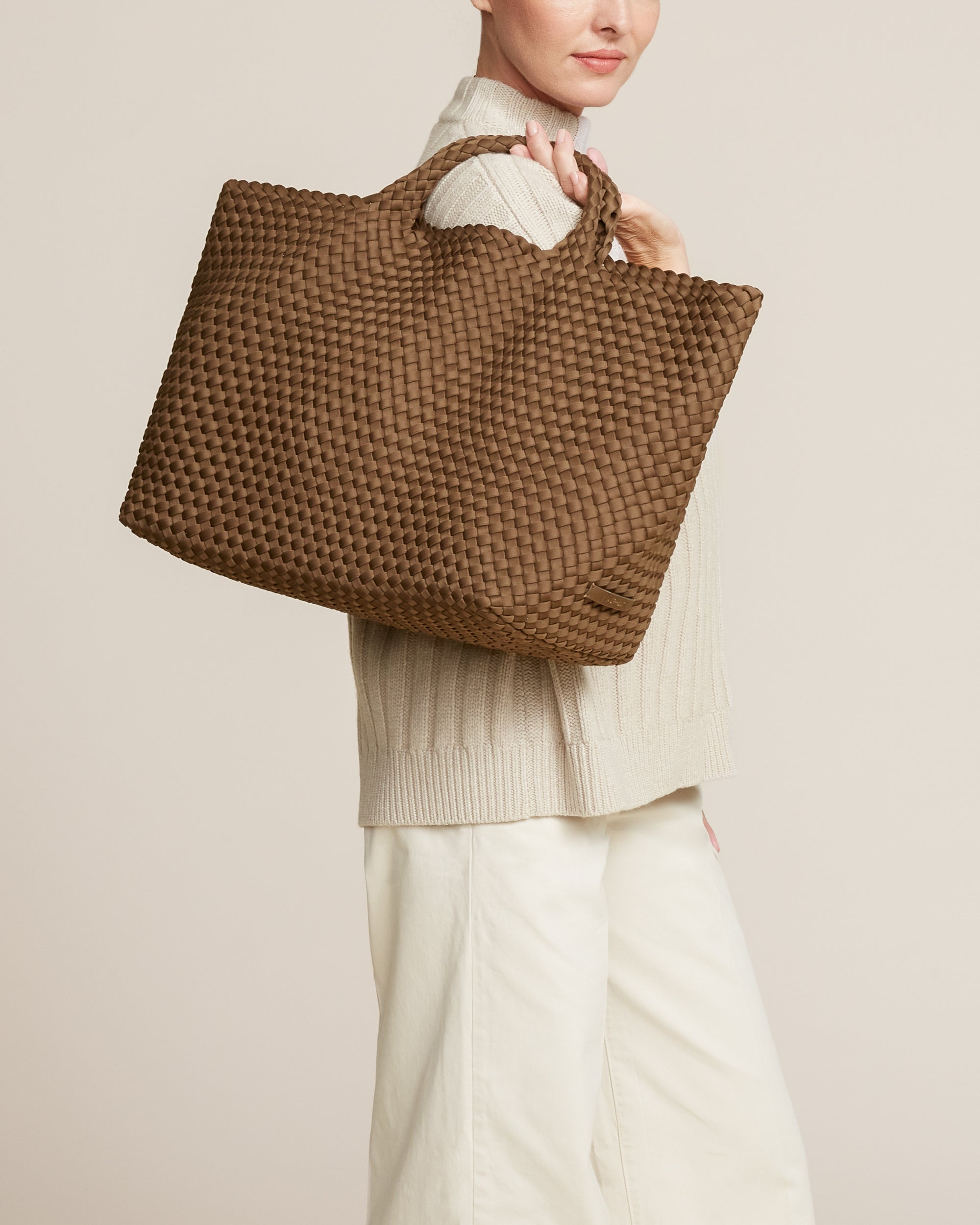 St. Barths Tote in Mink shown on model to illustrate scale and soft silhouette.