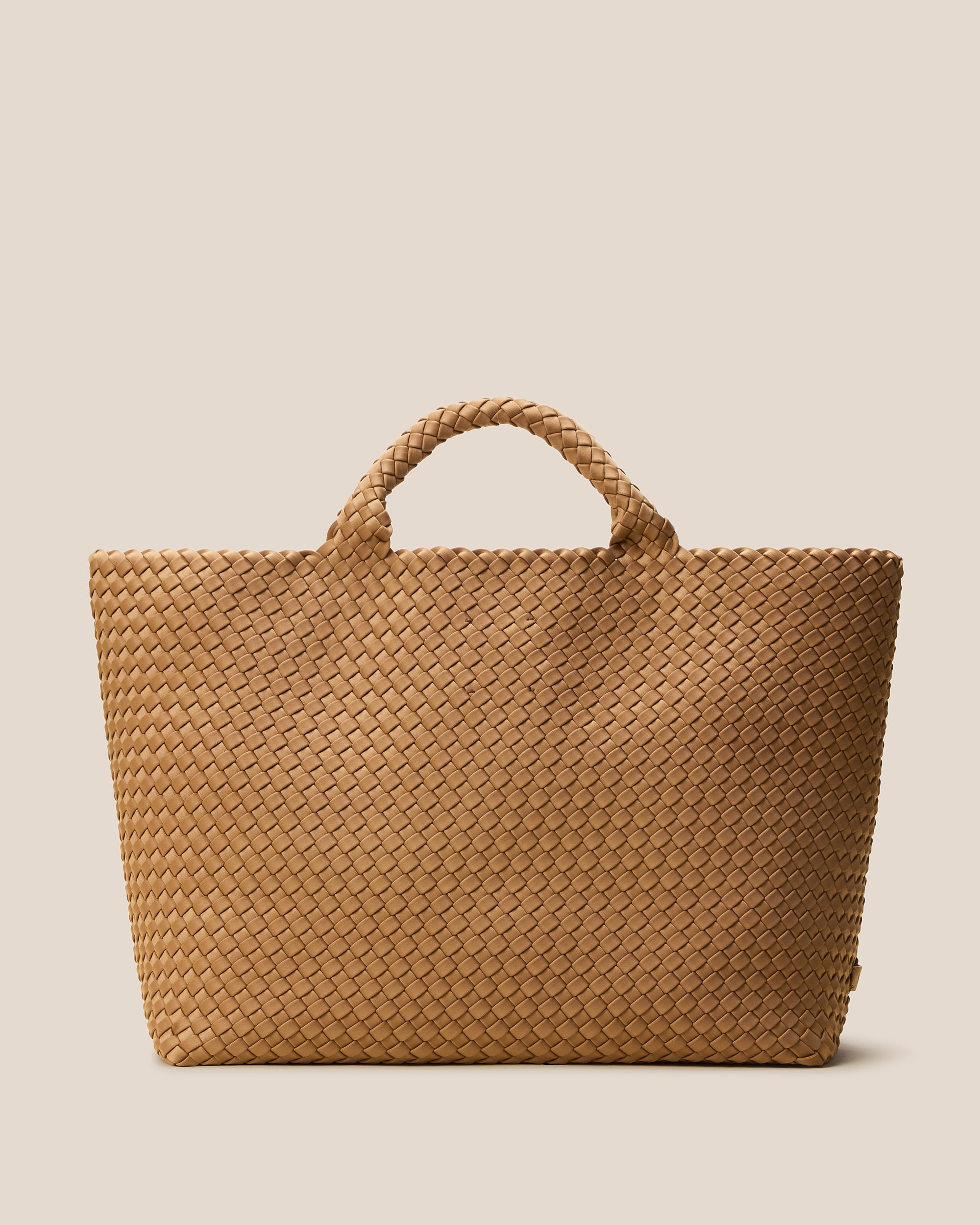 St. Barths Tote in Montauk, a tan brown tone, in handwoven neoprene, featuring an open top, and woven top handles.