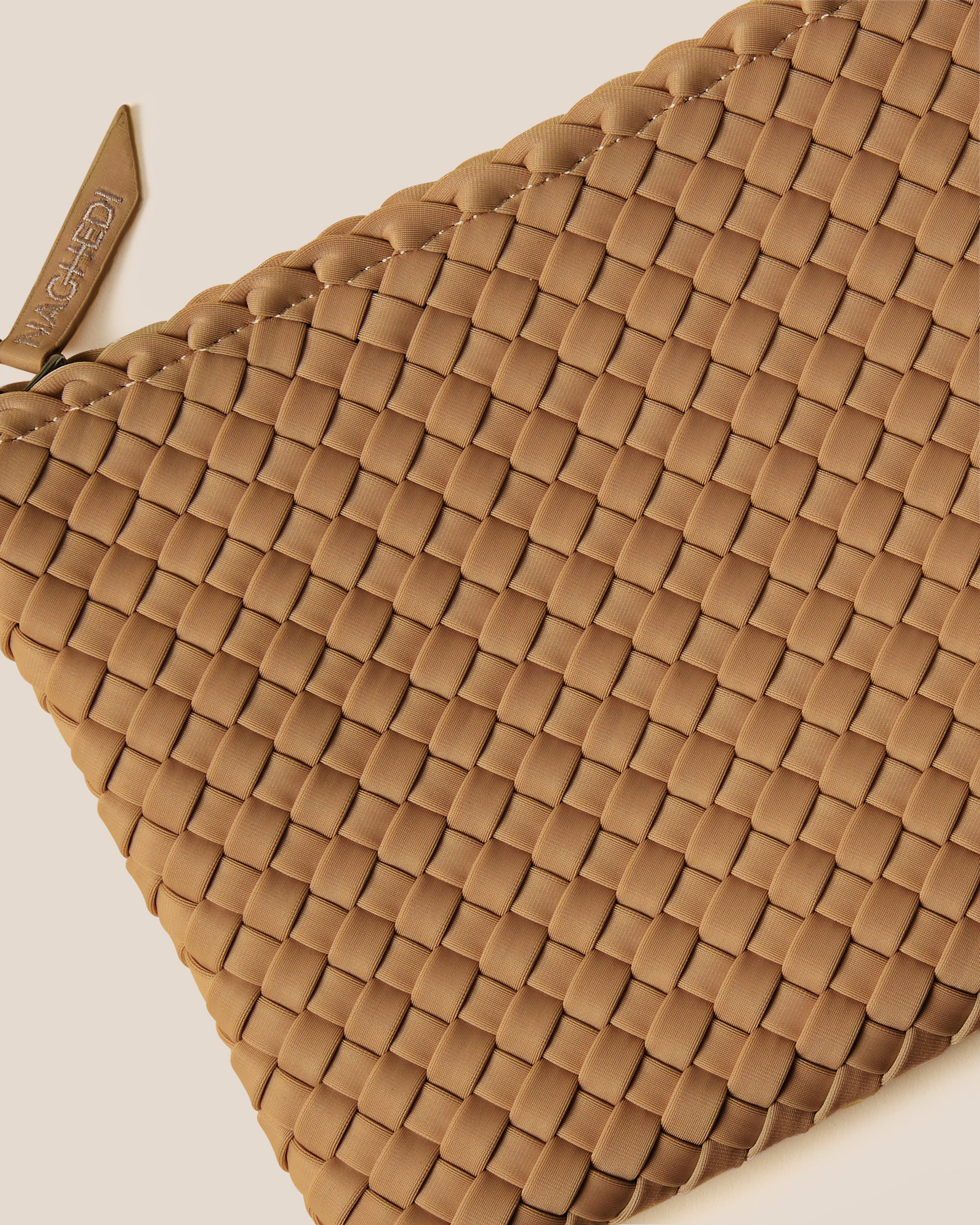 Close-up of included matching woven zippered pouch.