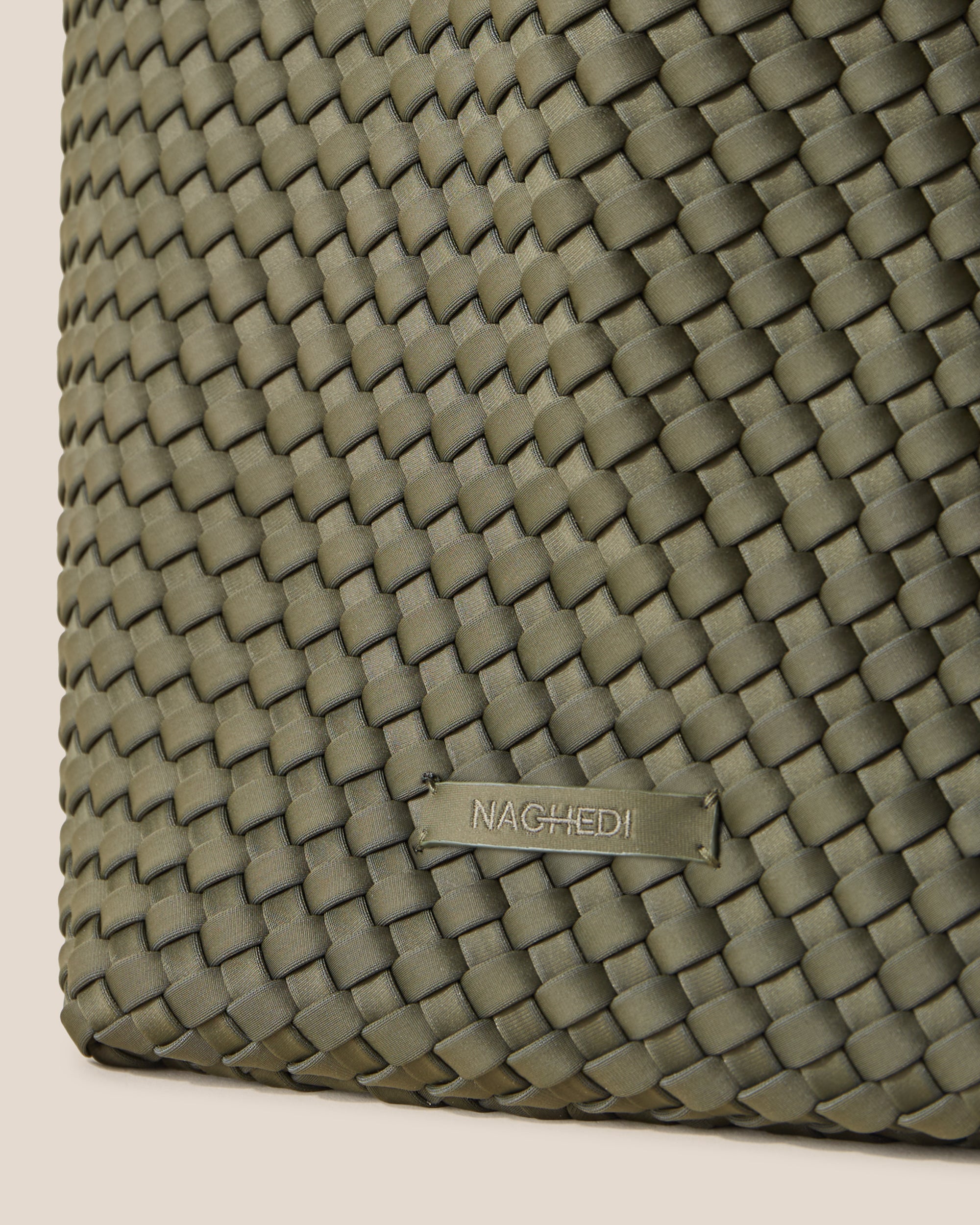 Close-up of stamped NAGHEDI logo on St. Barths Tote in Olive.