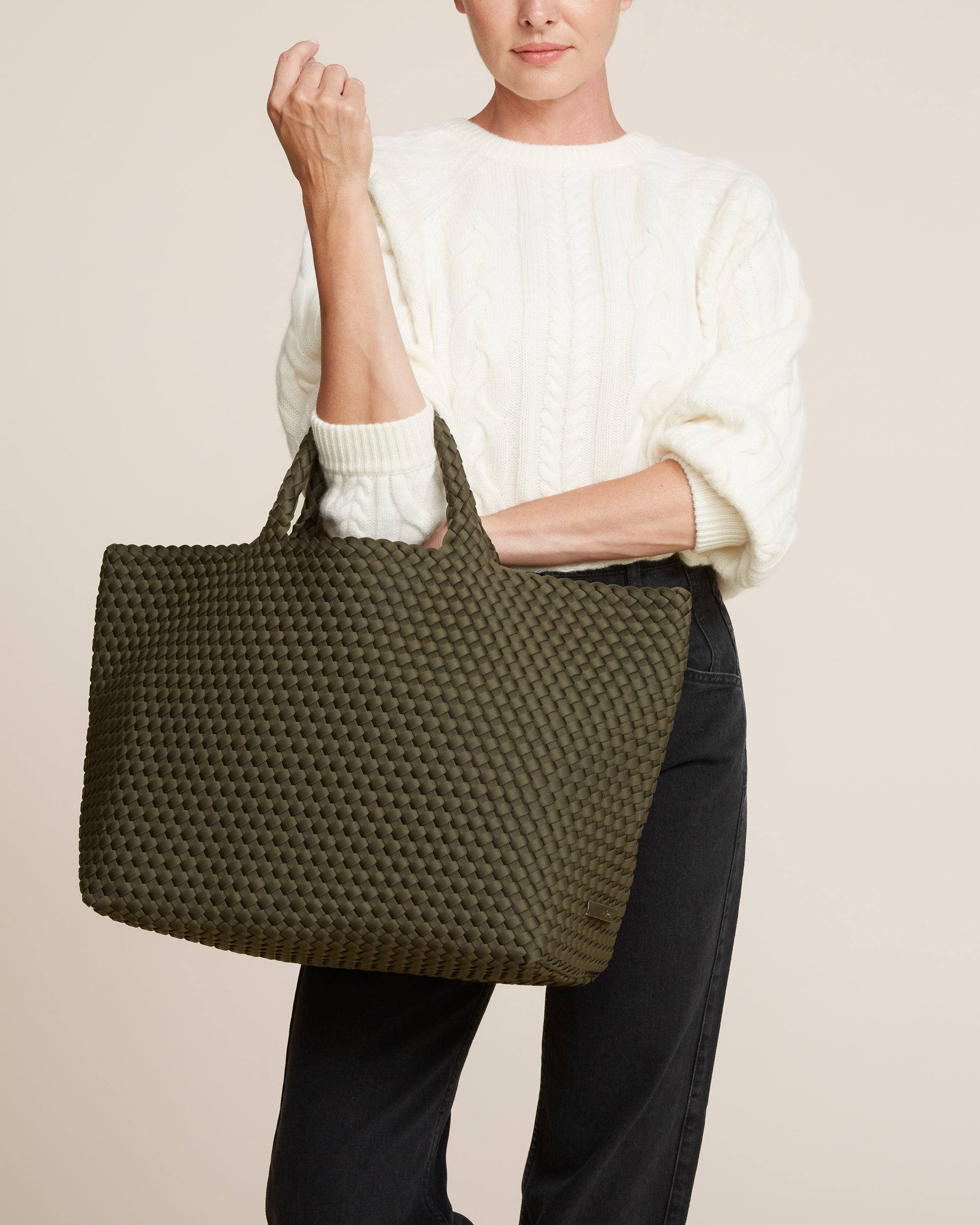 St. Barths Tote in Olive shown on model to illustrate scale and soft silhouette.