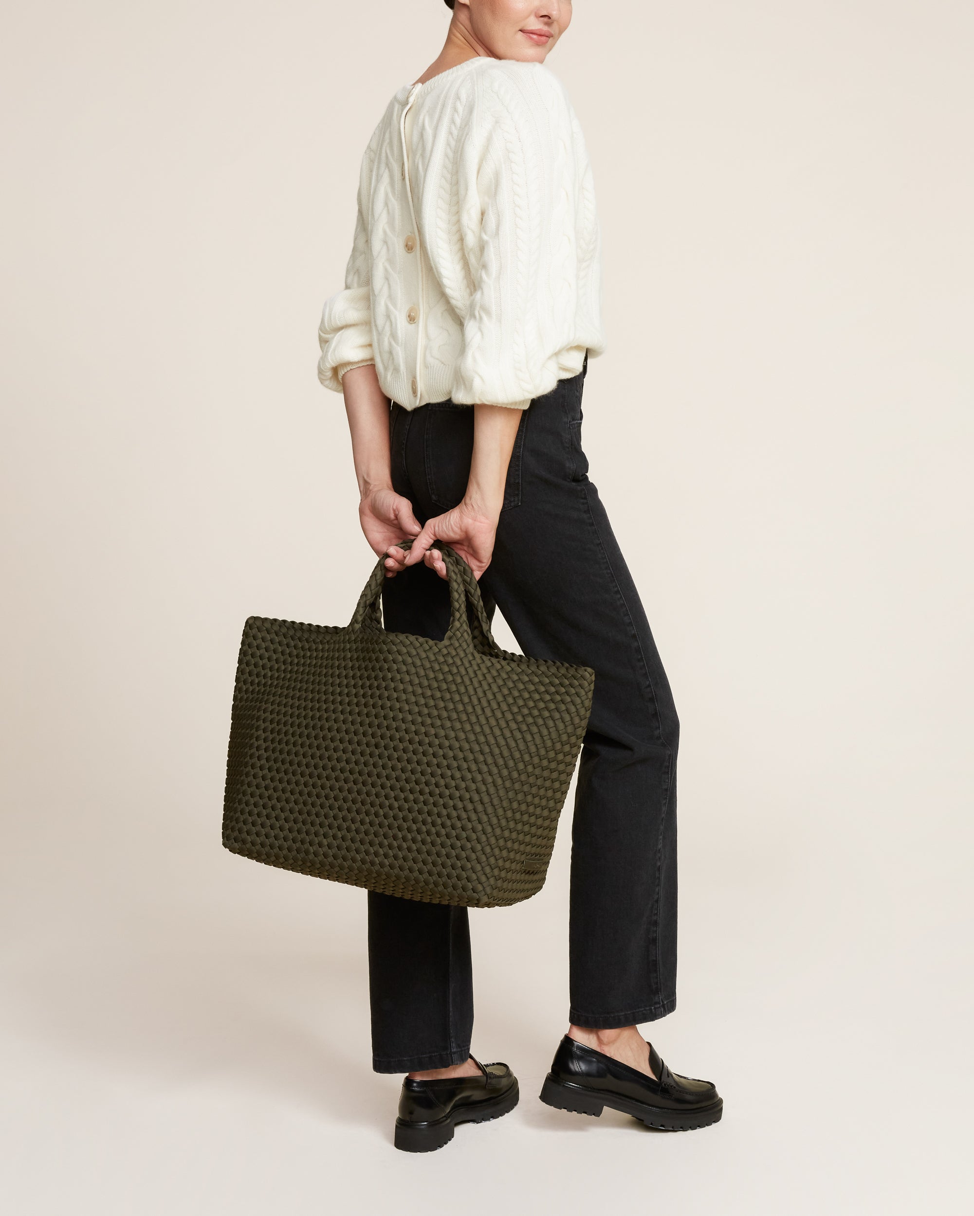 St. Barths Tote in Olive shown on model to illustrate scale and soft silhouette.