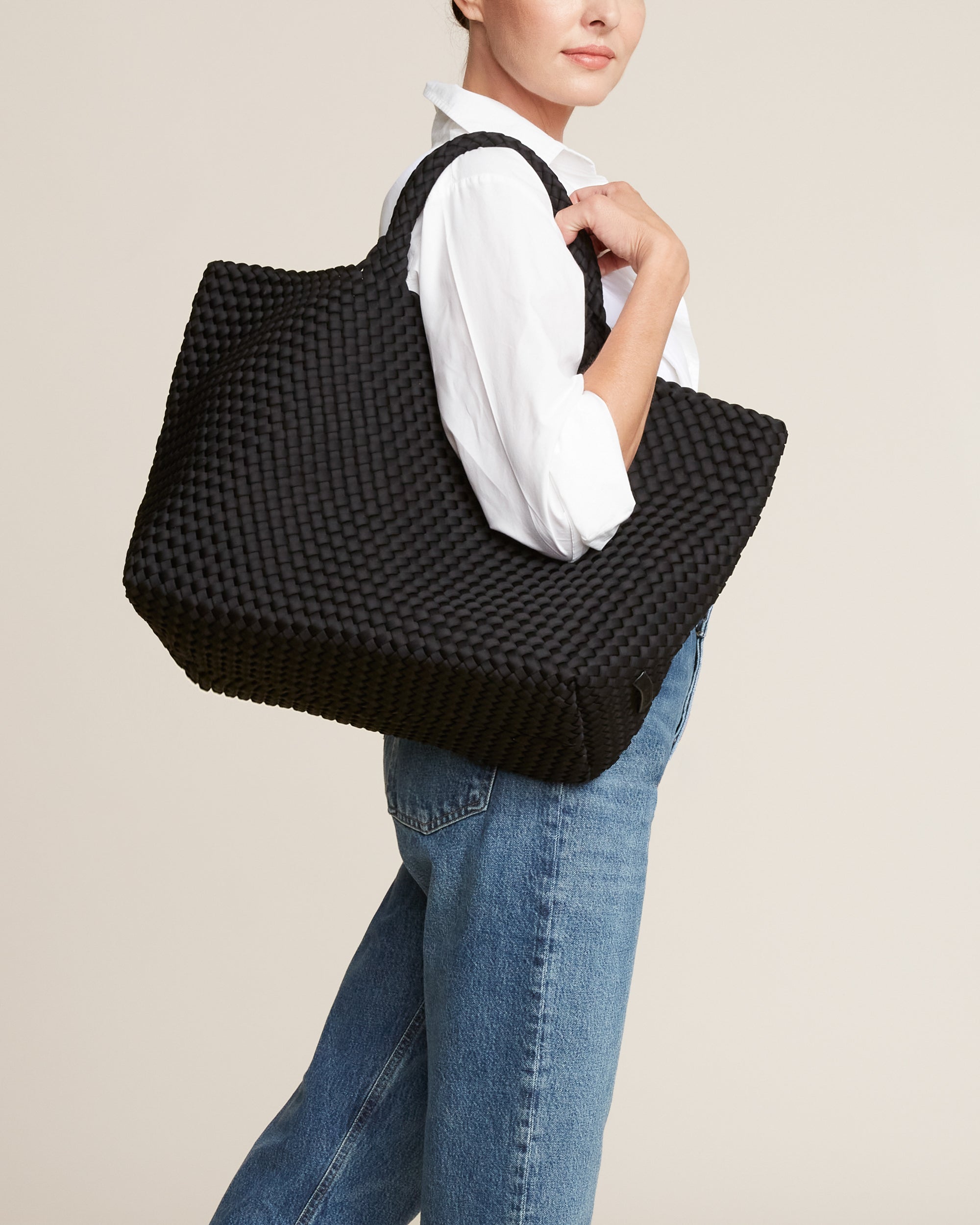 St. Barths Tote in Onyx shown on model to illustrate scale and soft silhouette.