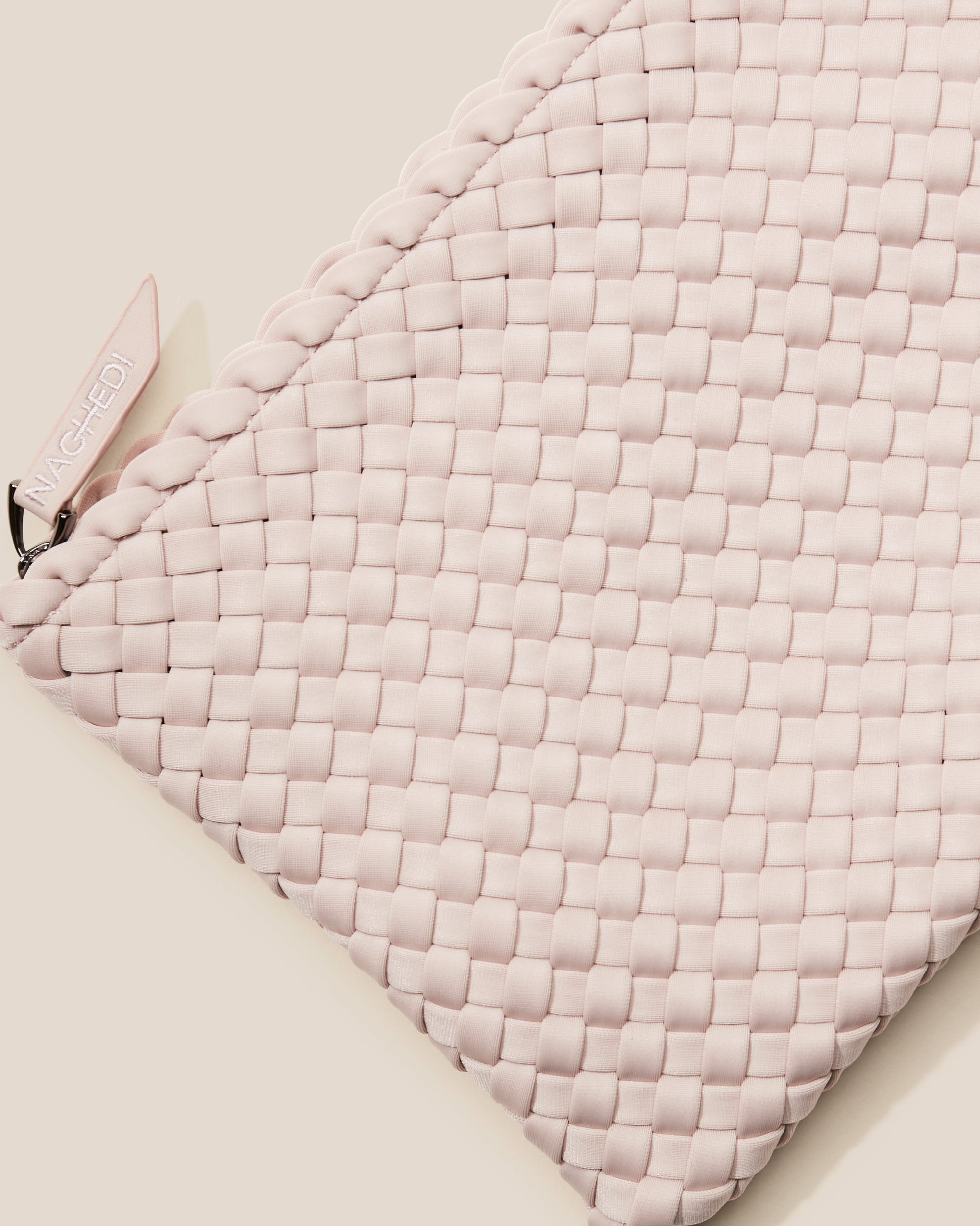 Close-up of included matching woven zippered pouch.