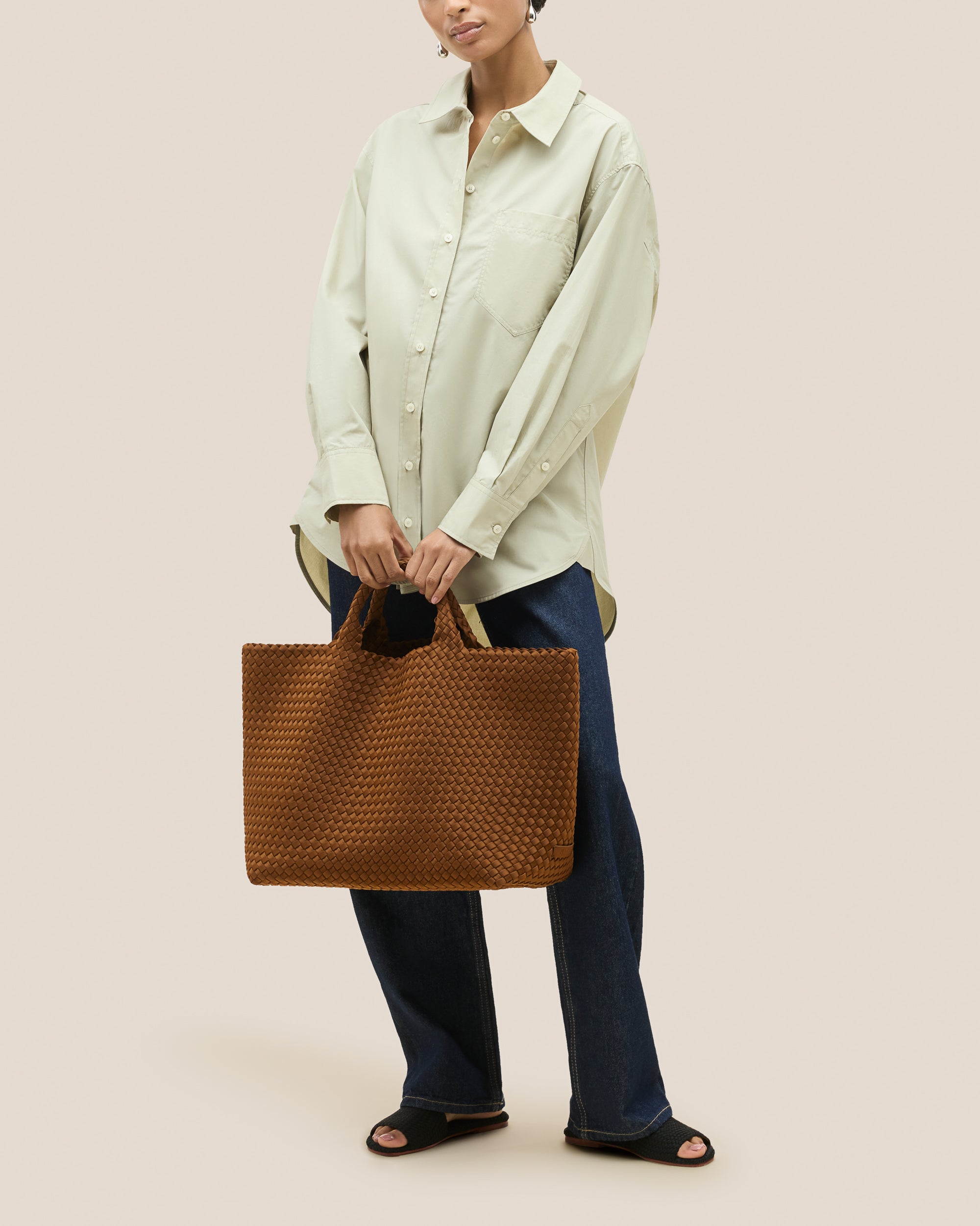 St. Barths Tote in Teak shown on model to illustrate scale and soft silhouette.